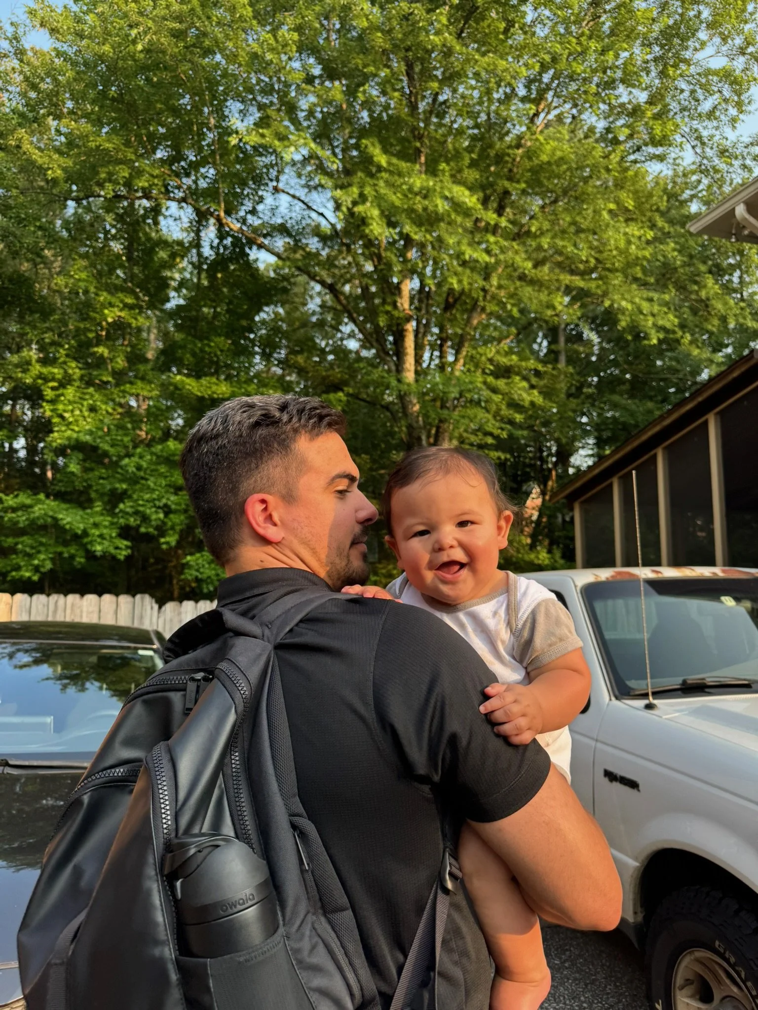 Kanoa greeting Dada when he gets home from work