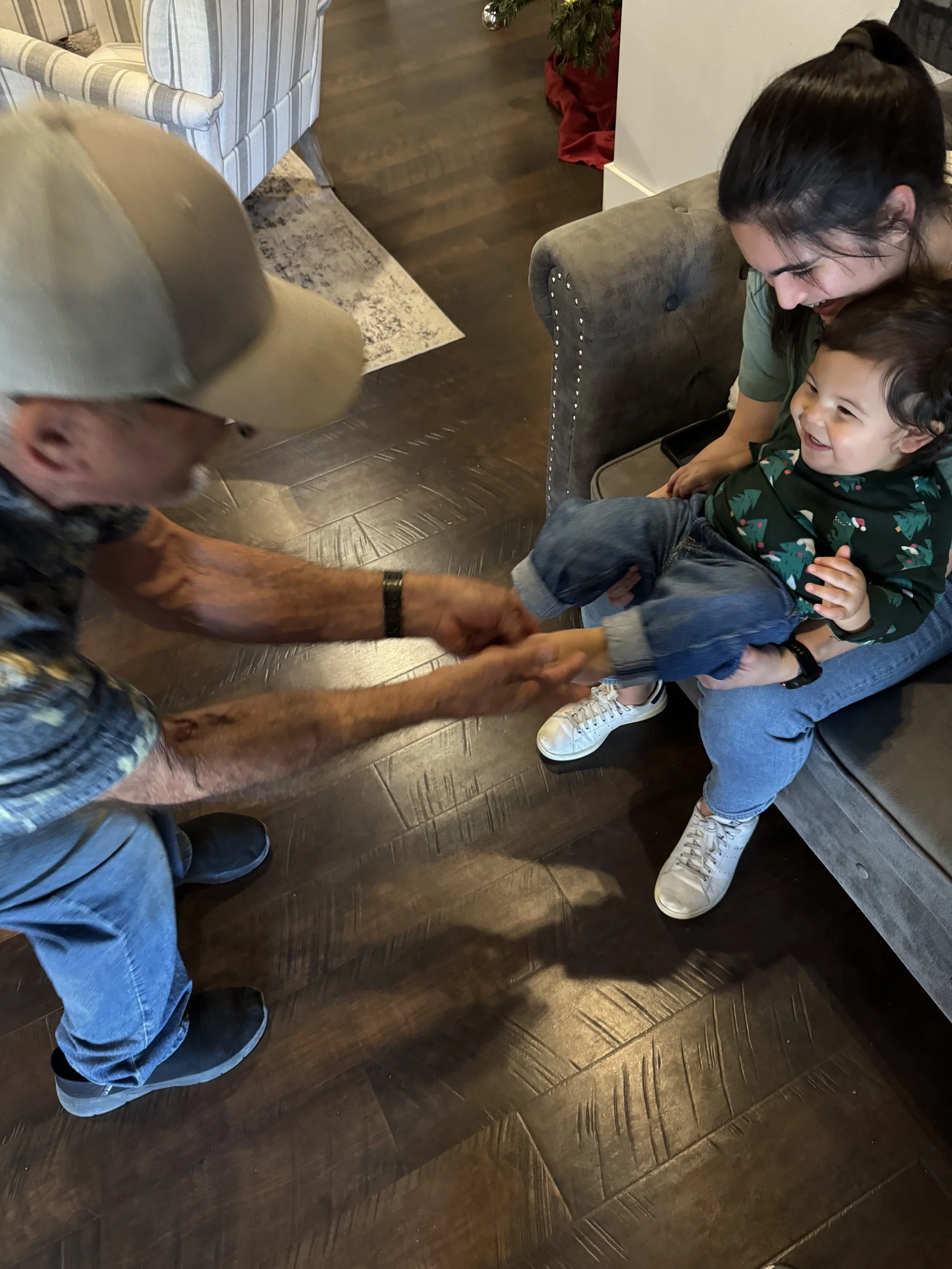 Uncle Phillip tickling Kanoa's toes :D