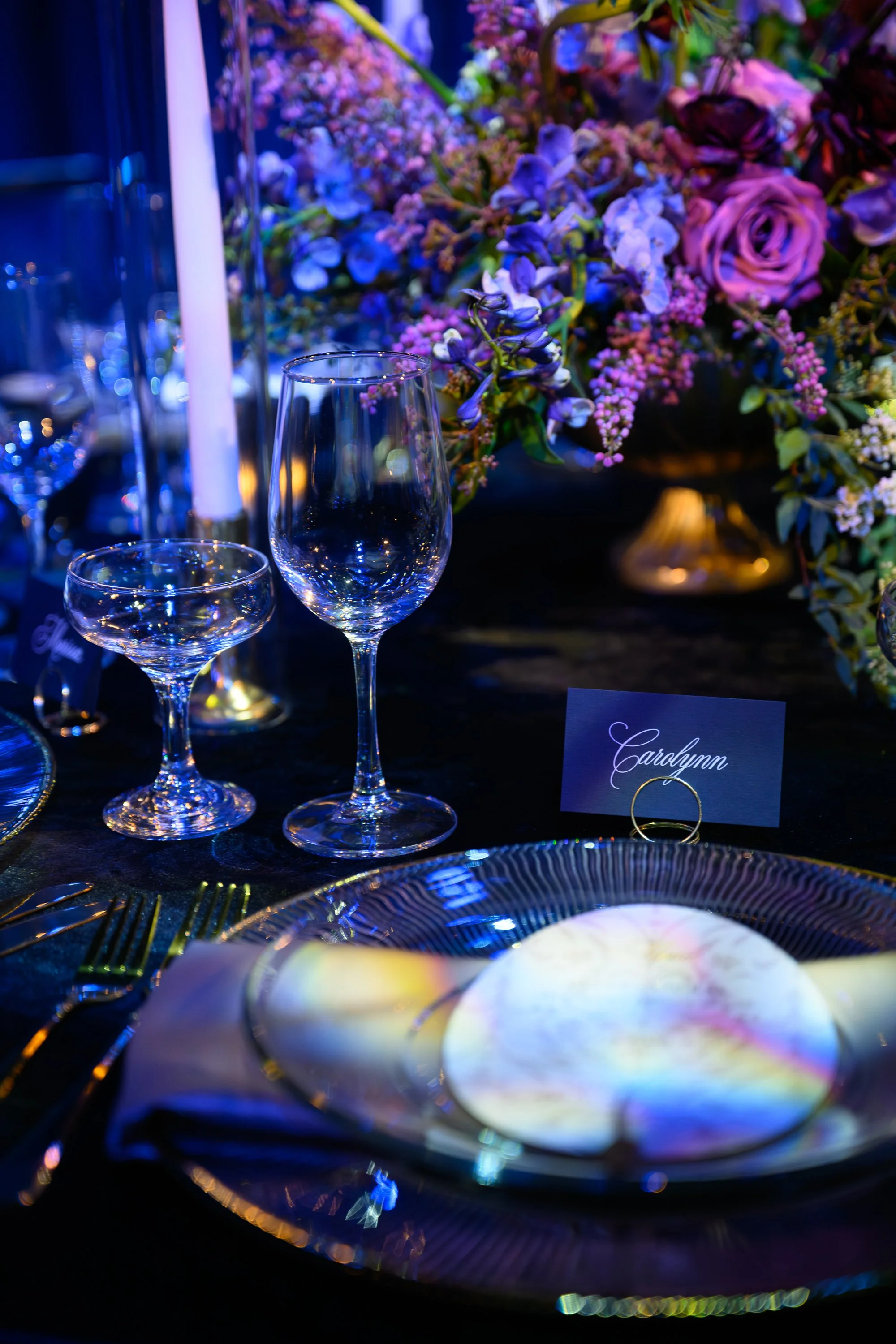 Elegant Wedding Place Setting with Candlelight and Floral Centerpiece