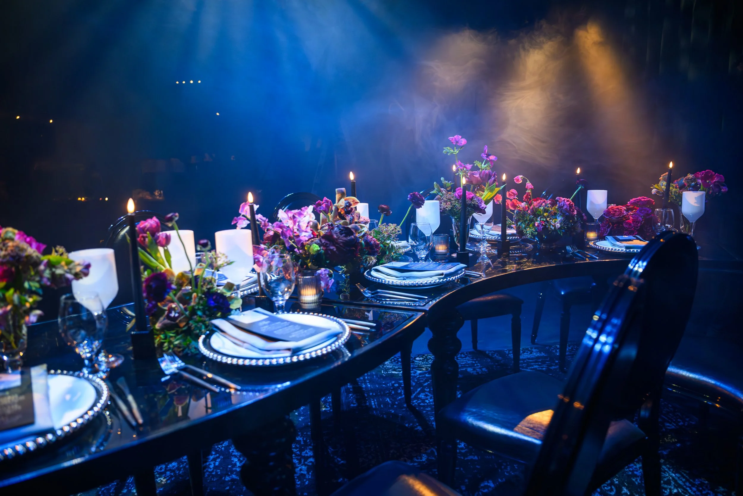 Moody dark romance wedding styled shoot with rich florals, elegant tablescape, and candlelight