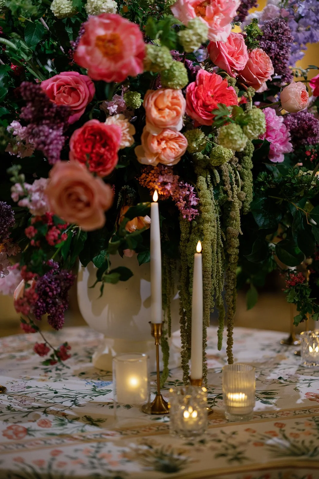 Colorful New England wedding floral design and candlelit tablescape