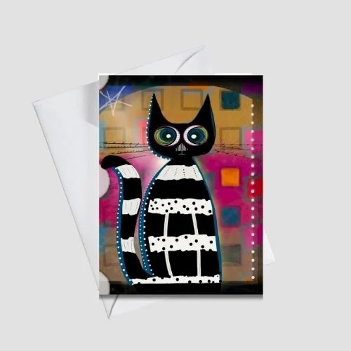 Whimsical black-and-white cat greeting card with striped patterns and bright expressive eyes on a colorful geometric background, shown with a white envelope, by Wild Thorn Collective.