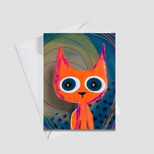 Whimsical orange cat greeting card with oversized starry eyes and playful texture on a teal and charcoal abstract background, shown with a white envelope, by Wild Thorn Collective.