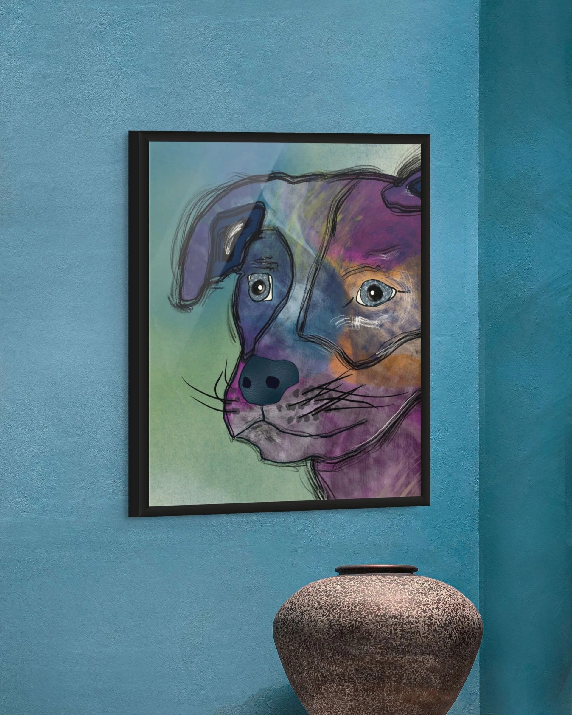 Stargazer Dog art print by Wild Thorn Collective, a colorful expressive dog portrait with layered blues and purples, shown in a black frame against a textured blue wall.