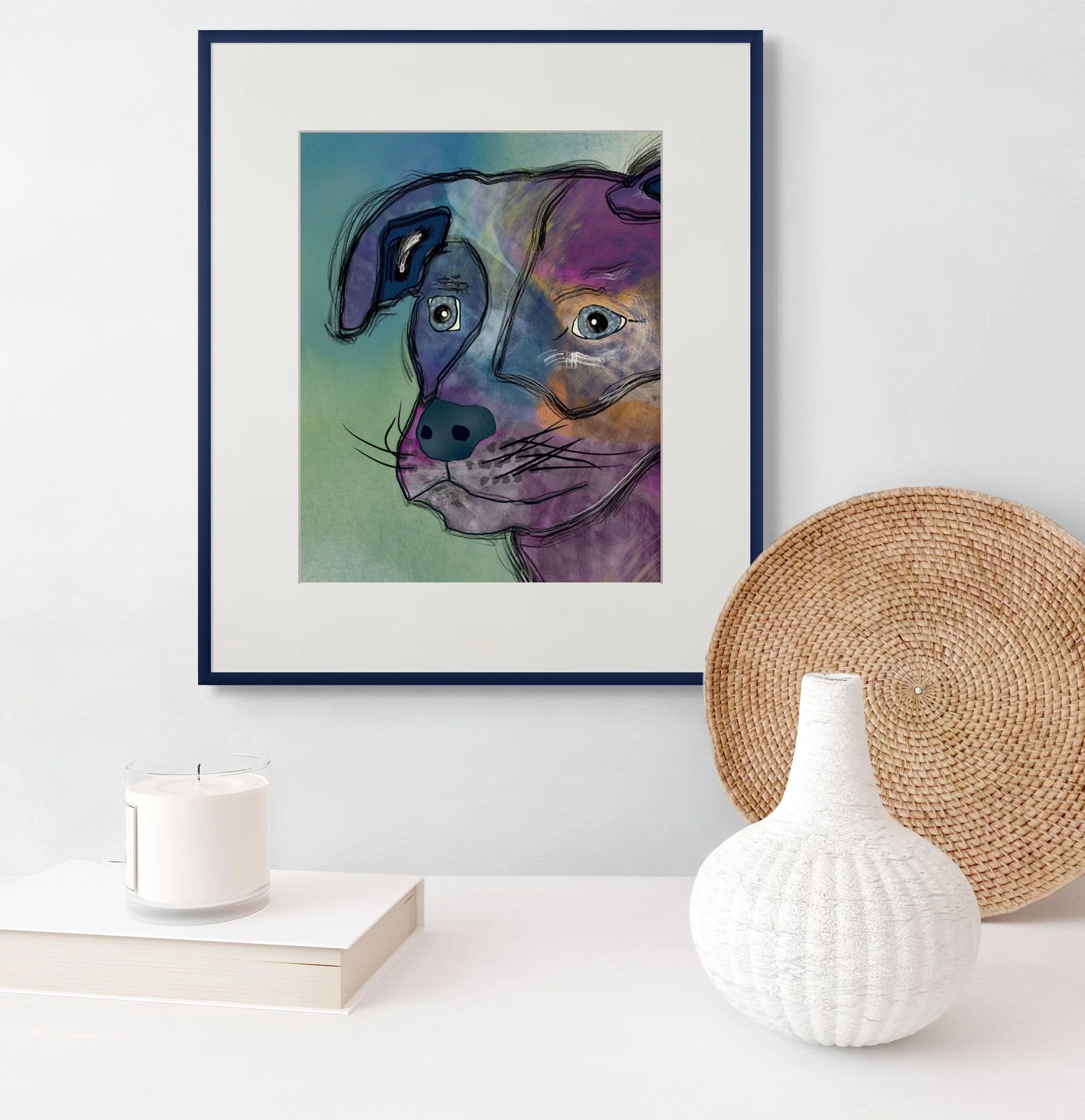 Framed Stargazer Dog art print by Wild Thorn Collective, featuring a whimsical multicolored dog with expressive eyes, displayed in a white mat and navy frame on a minimalist shelf.