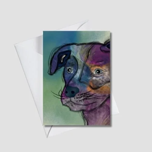 Whimsical dog greeting card with expressive starry eyes and layered purple and blue tones on a soft green background, shown with a white envelope, by Wild Thorn Collective.