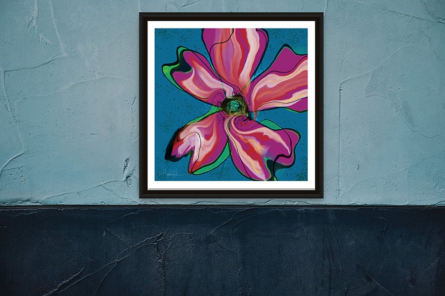 A framed abstract floral artwork with vivid pink and magenta petals on a teal-blue background, styled on a blue textured wall