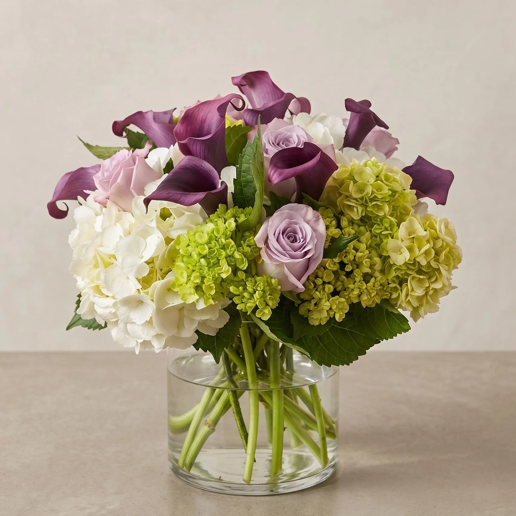 Custom arrangement sent out today. We love these purple haze roses! 

#atlanta #florist #purplehaze #hydrangeas #callalily