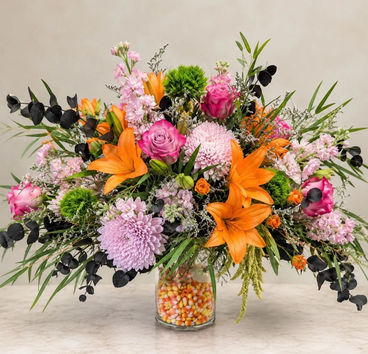 We made this arrangement for a 2 year old girl&rsquo;s birthday party @theworksatl - The Works on Chattahoochee Avenue. The birthday invite was these colors and it says, &ldquo;Our little BOO is turning two!&rdquo; with little candy corn, spiders, gh