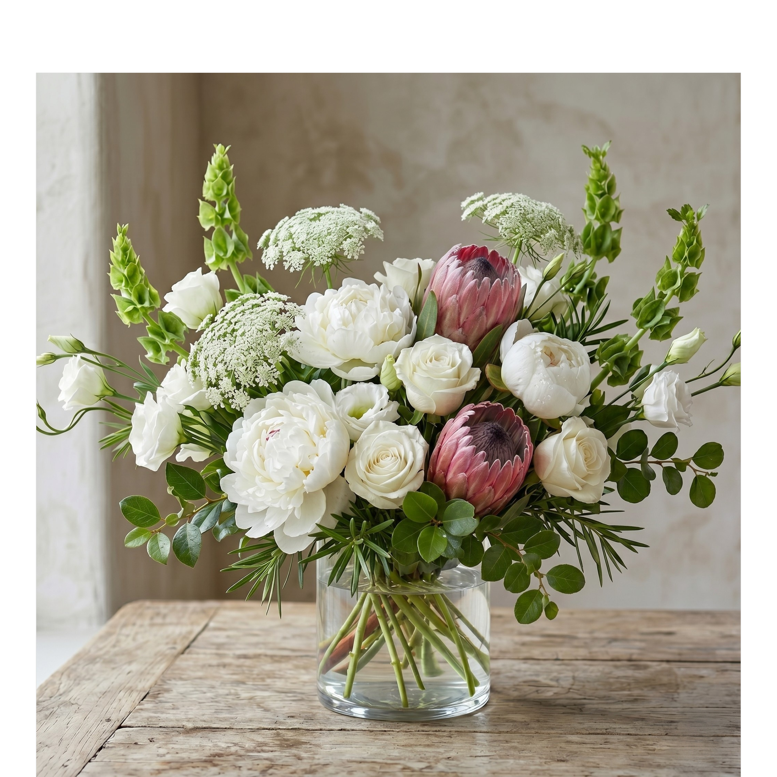 white arrangement with proteas.png