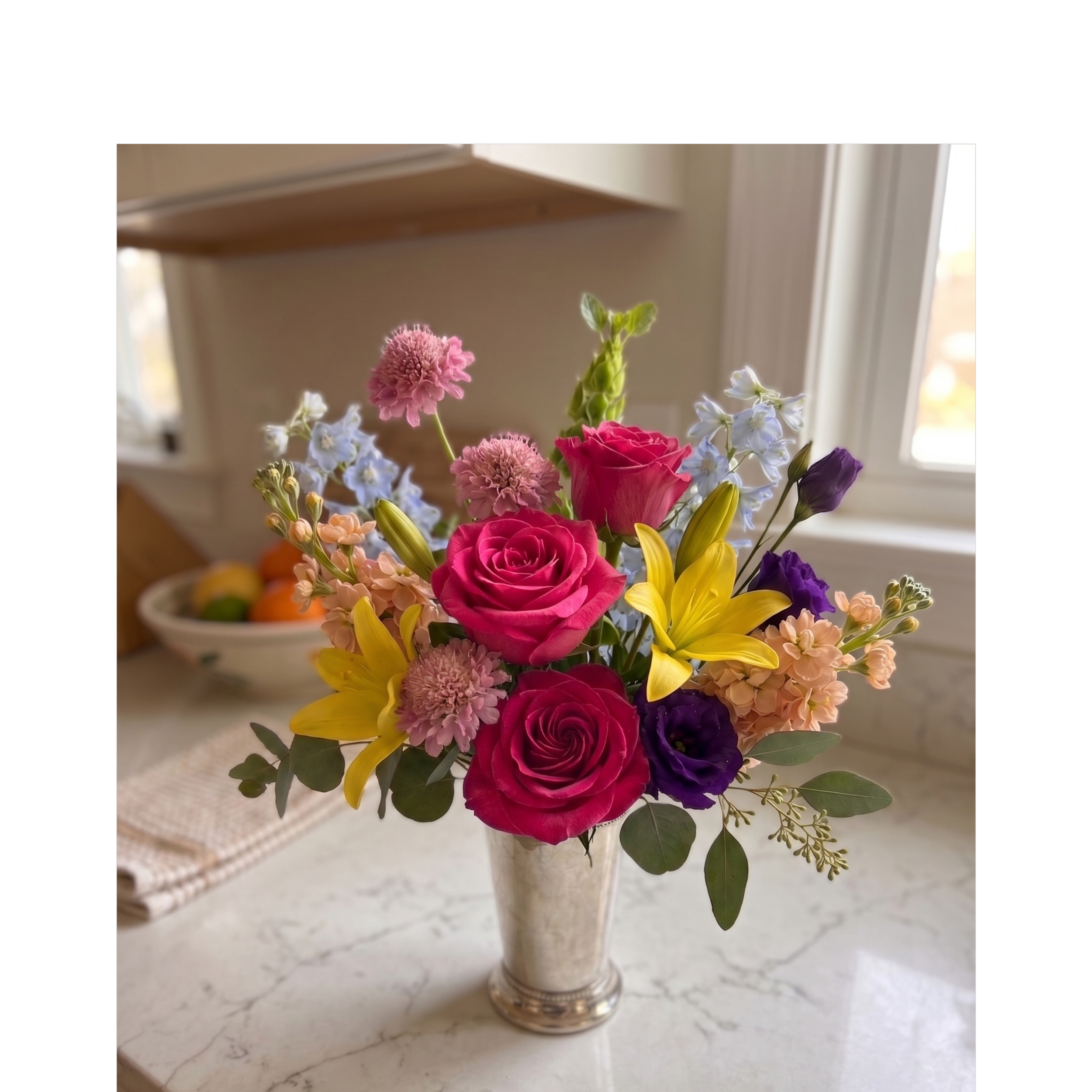 mixed flowers in mint julep vase (1).png