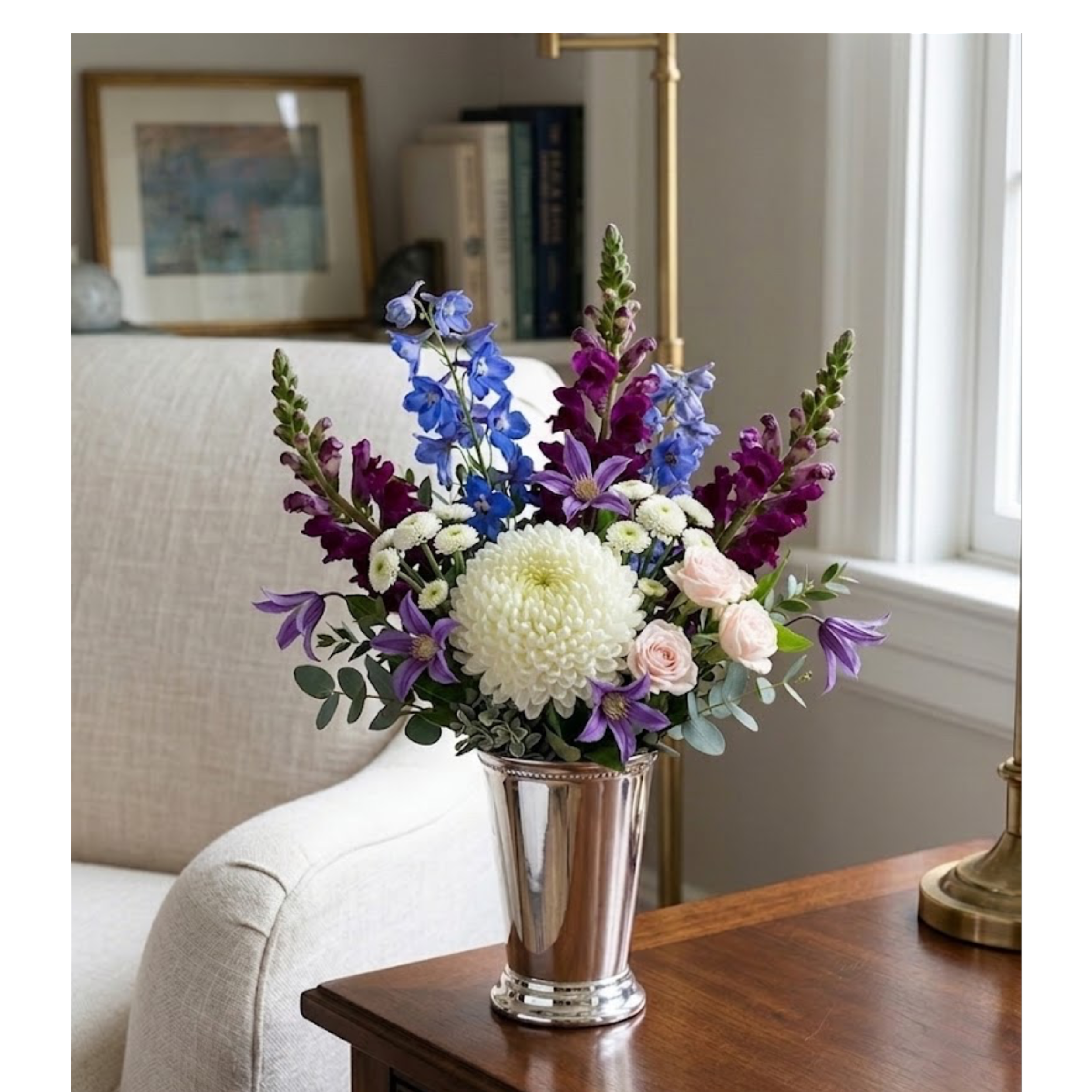 mixed flowers in mint julep vase.png