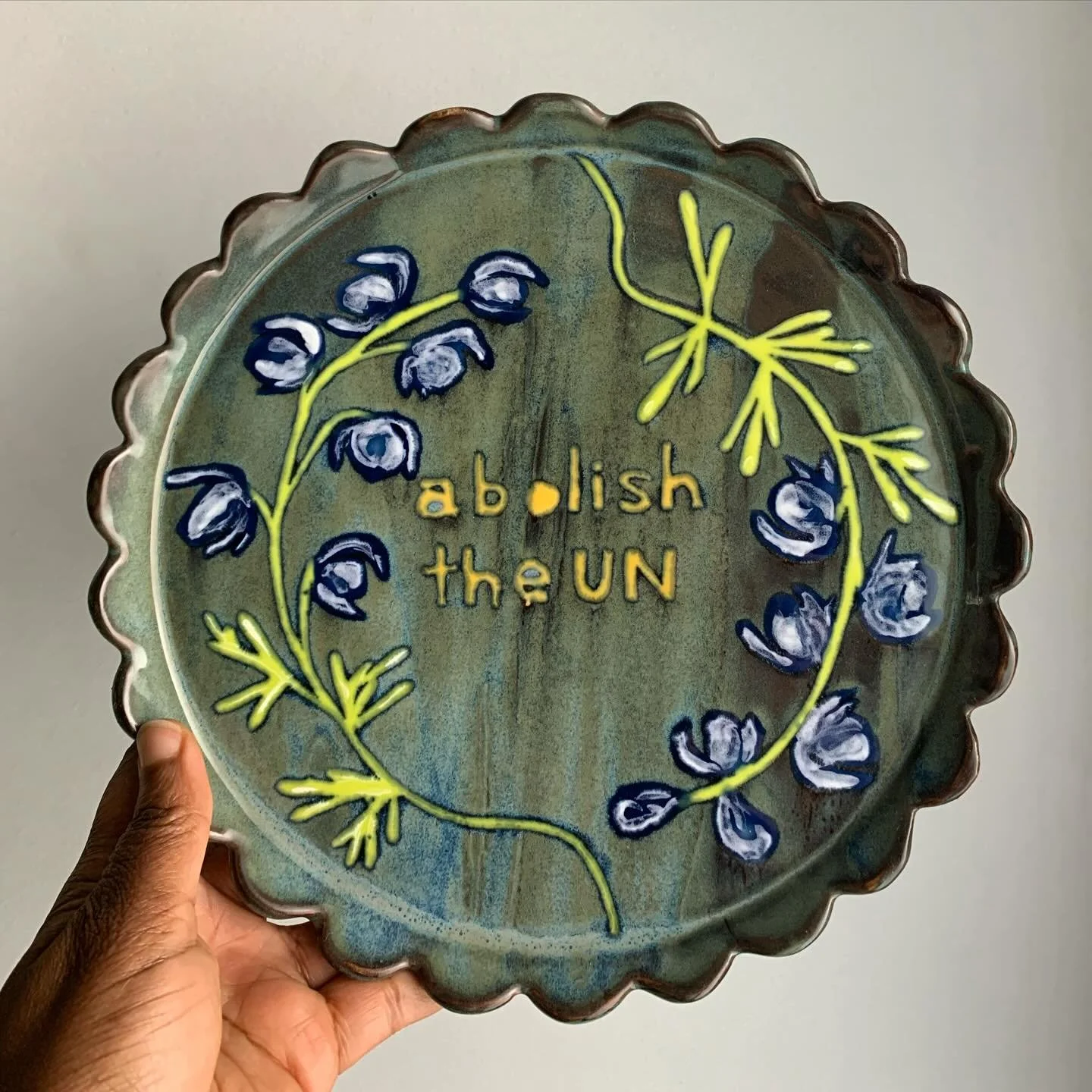 decorative plate
reads
&rdquo;abolish the un&rdquo;