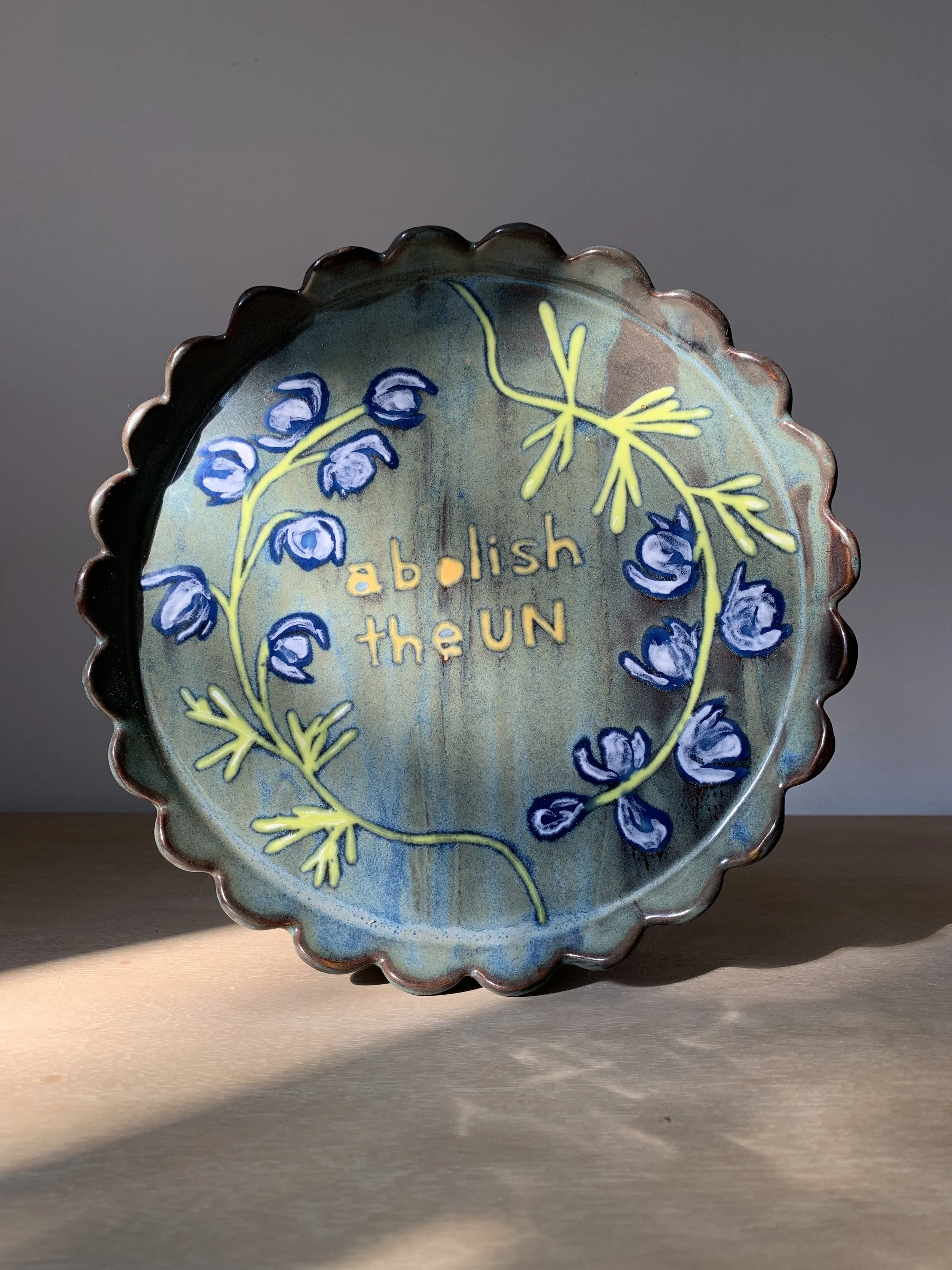 Abolish the U.N., stoneware decorative plate, 2025.