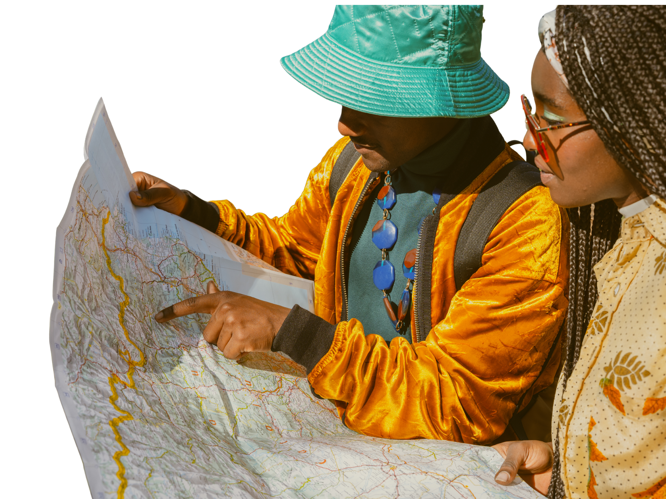 Two women looking at a large map outdoors. One woman is pointing at the map, wearing a turquoise hat and a yellow jacket. The other woman has braided hair and glasses, wearing a yellow patterned shirt.