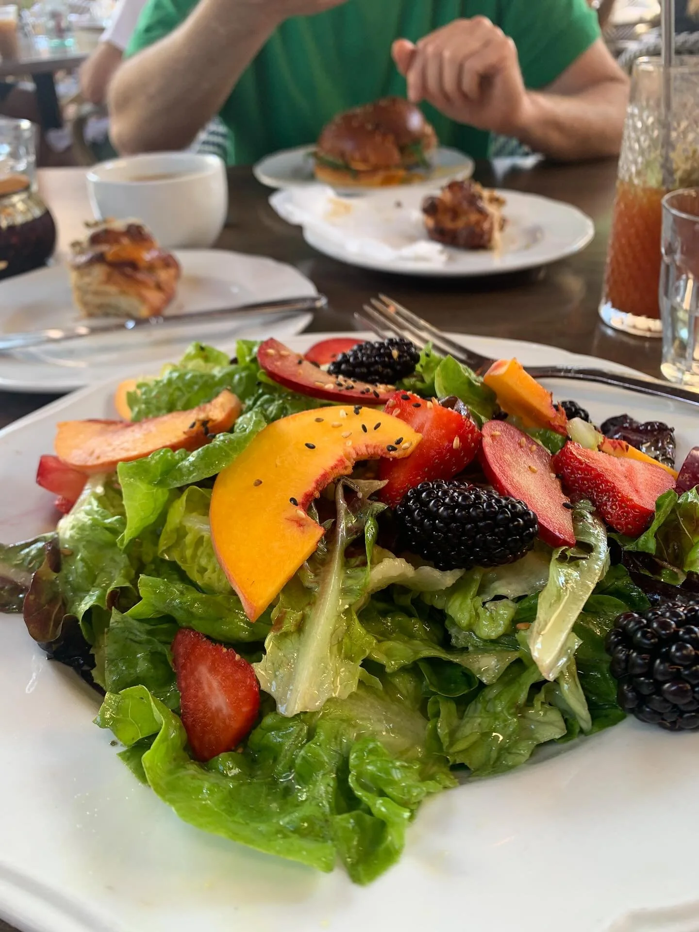 Have the pastry. Just eat the salad first. 

Eating fiber first, then protein/fats and ending with the simple carbs can do wonders to stabilize your blood sugar. 

So have the treat, just save it (or at least part of it!) until last.