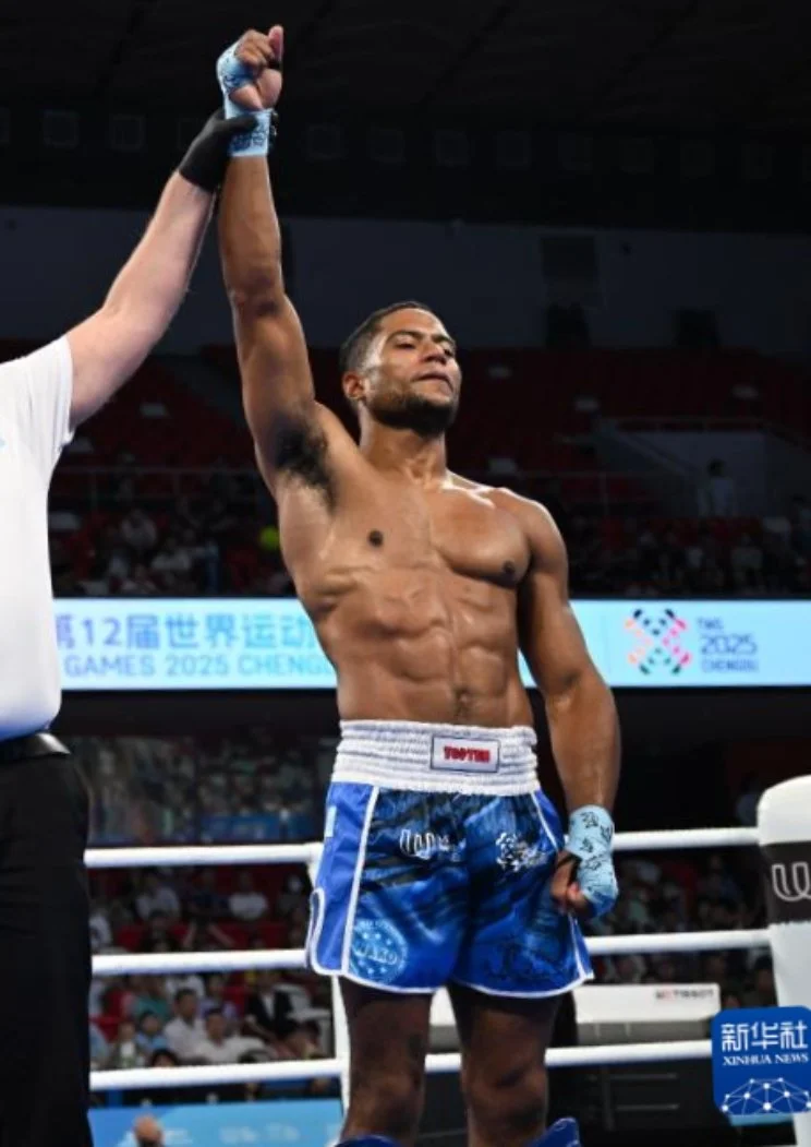 Kickboxer getting their hand raised in a victory at The World Games 2025