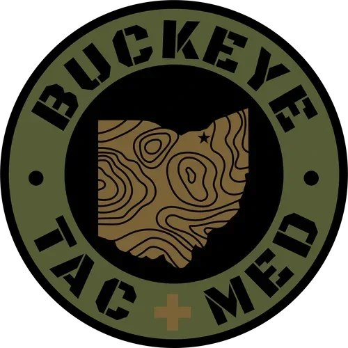 A logo featuring the outline of Ohio with topographic lines inside it, surrounded by a circular band that reads 'BUCKEYE TACTICS' and 'TO' and 'ME' with a small cross at the bottom.