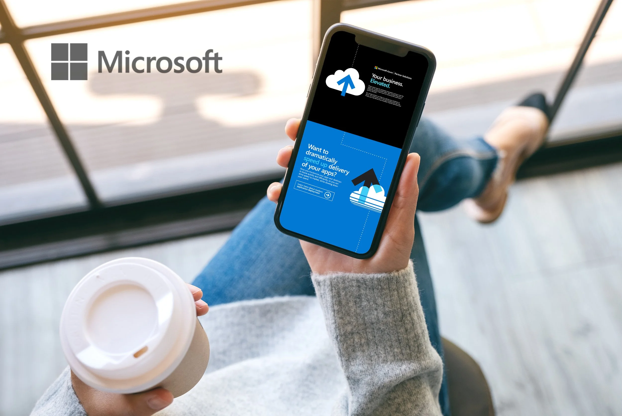 Person holding a smartphone displaying a Microsoft Azure cloud service advertisement with a cup of coffee in the other hand.