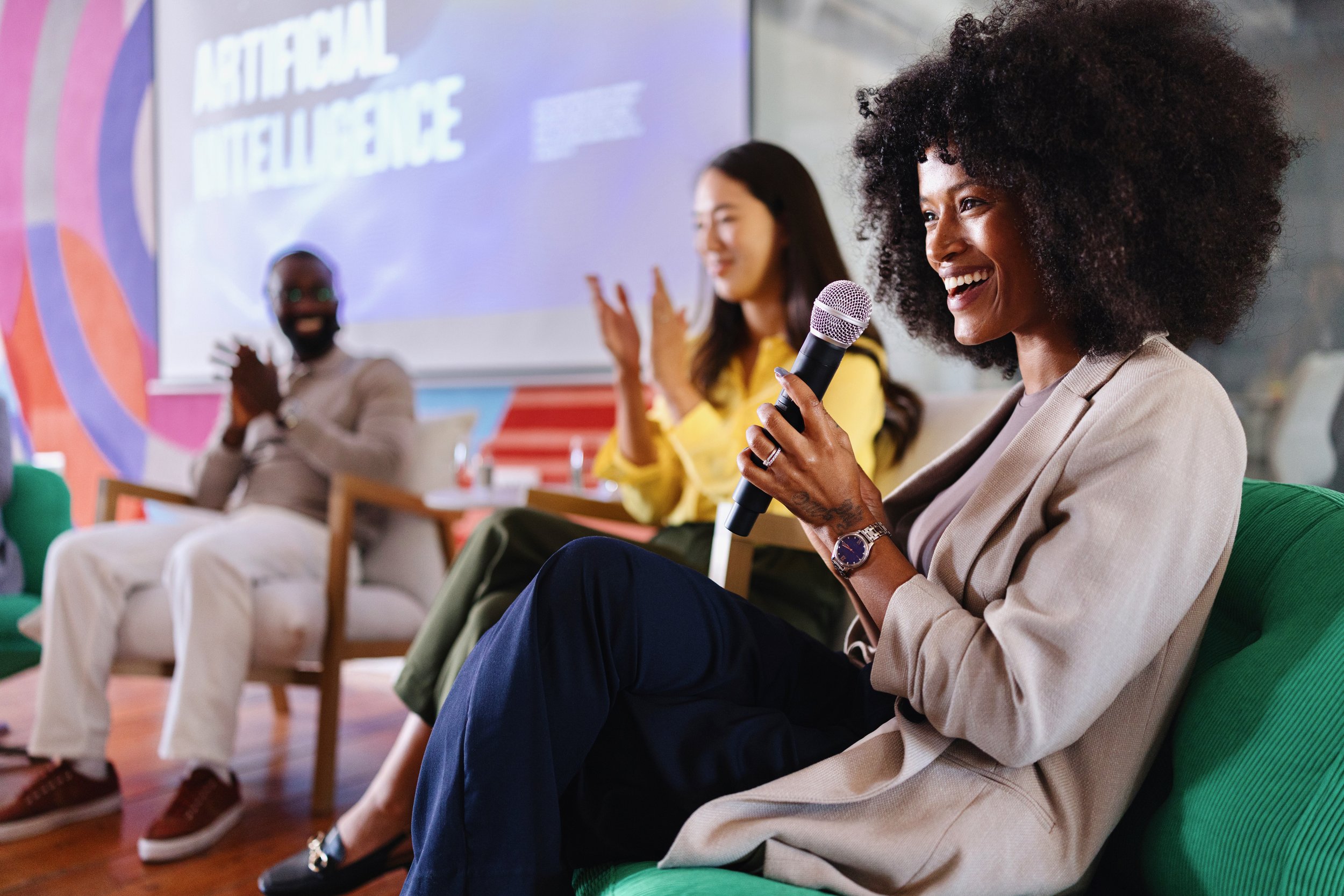 Panel of three presenting about AI at business event