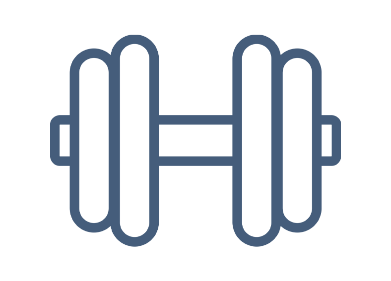 Person sitting in papasan chair reading with candles and books around, white walls.