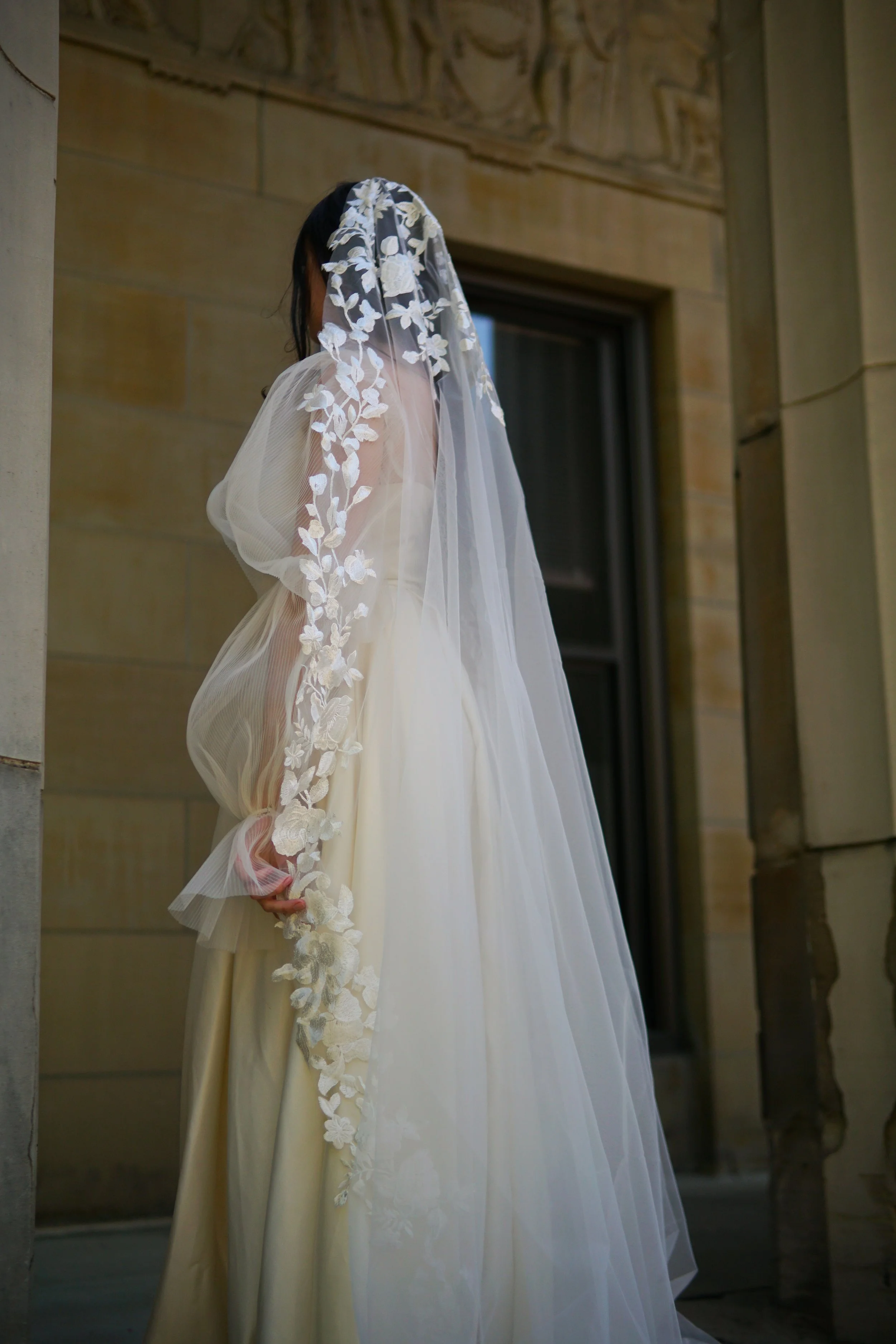 Bride wearing a full lace mantilla floral lace veil with mix of small and bigger flowersPG