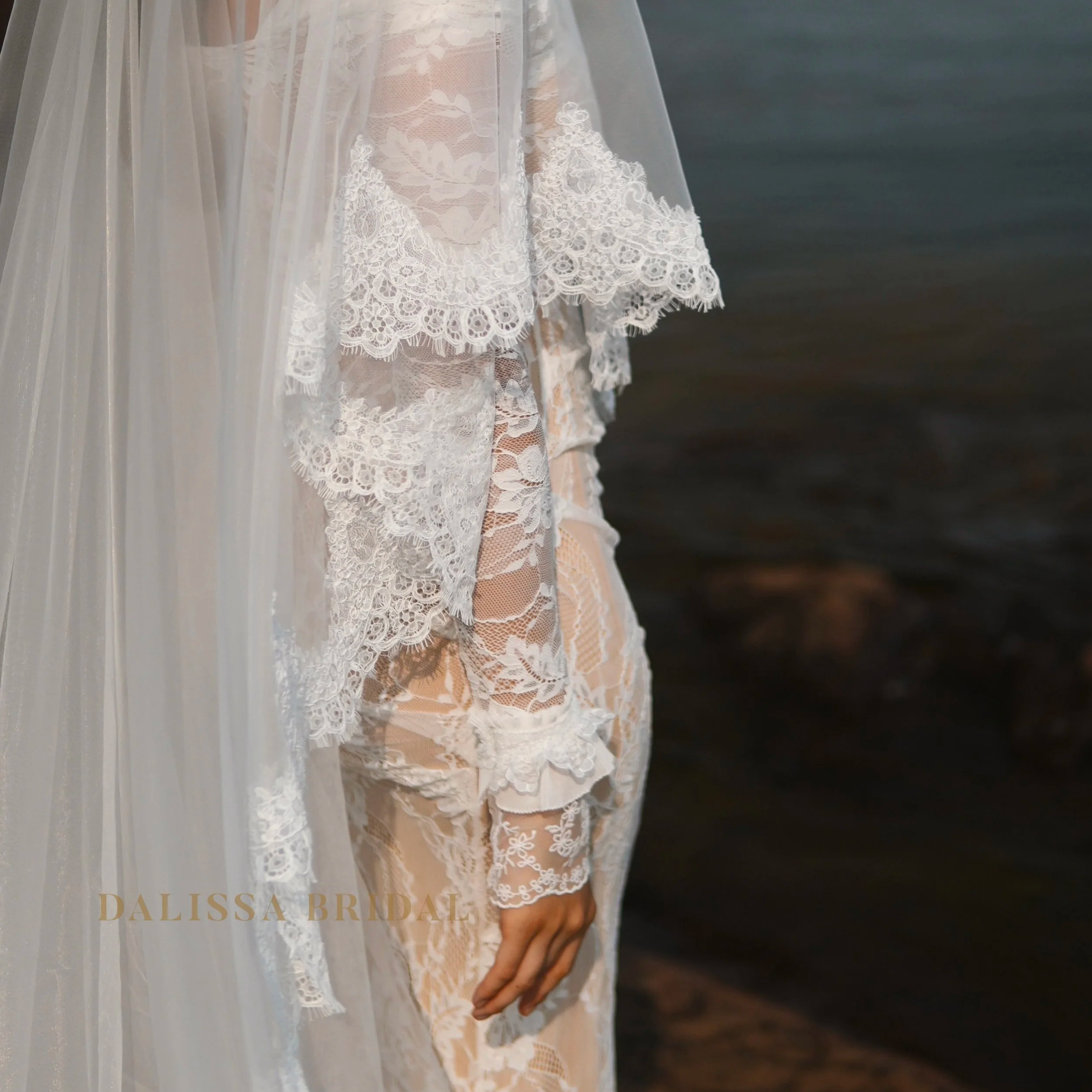 Close picture of the cantilly lace trim on the veil