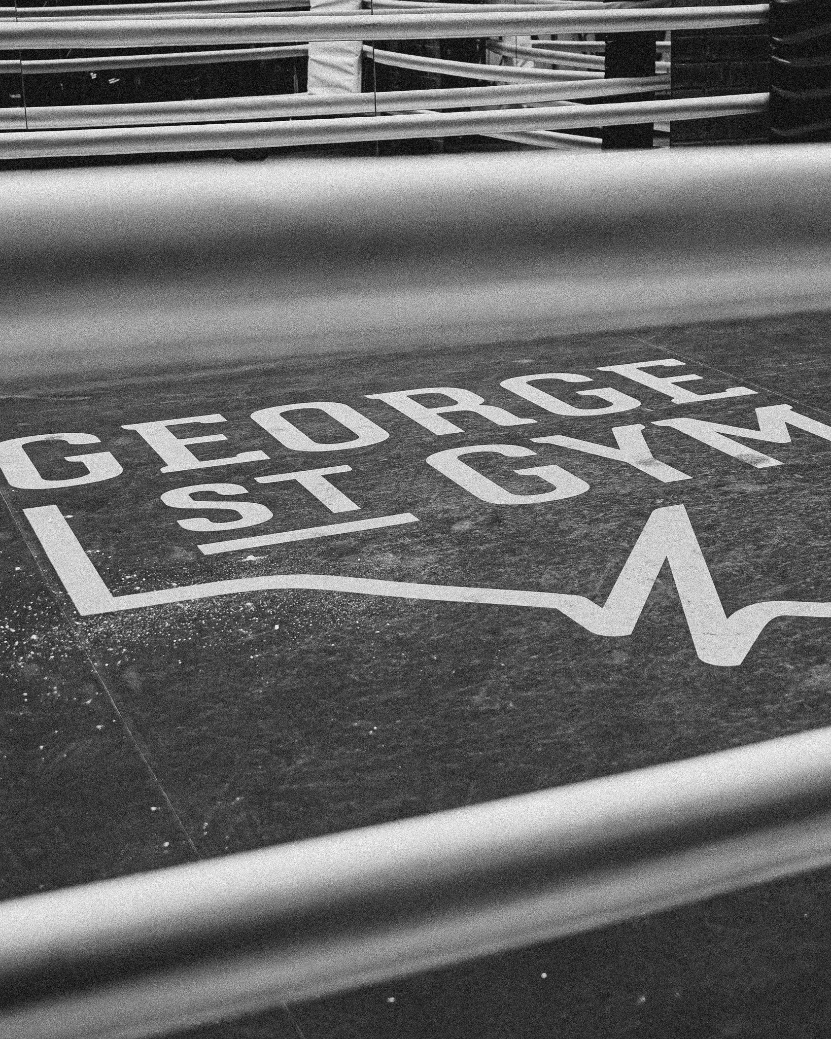 Floor with large painted sign that reads "GEORGE ST" and has a stylized heartbeat line.