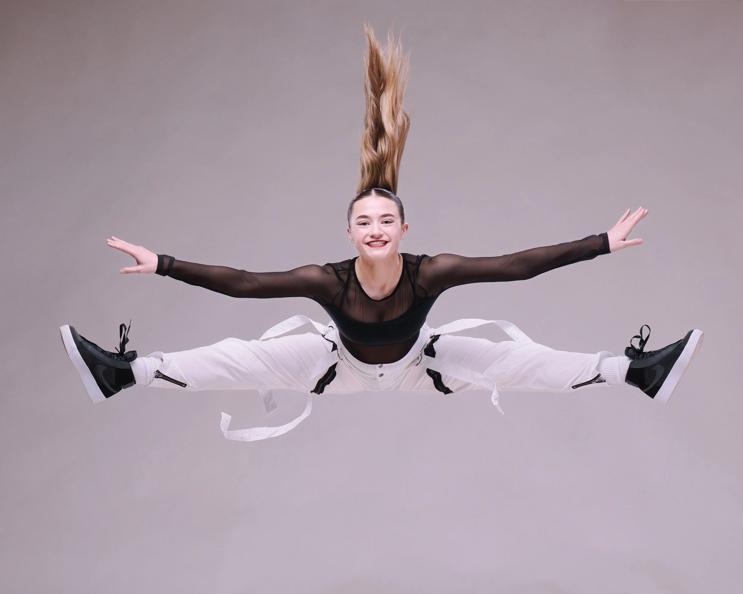 Commercial studio lighting and dramatic media day portraits for dance schools, cheer squads, and gymnastics studios by Justin Grafton Studios