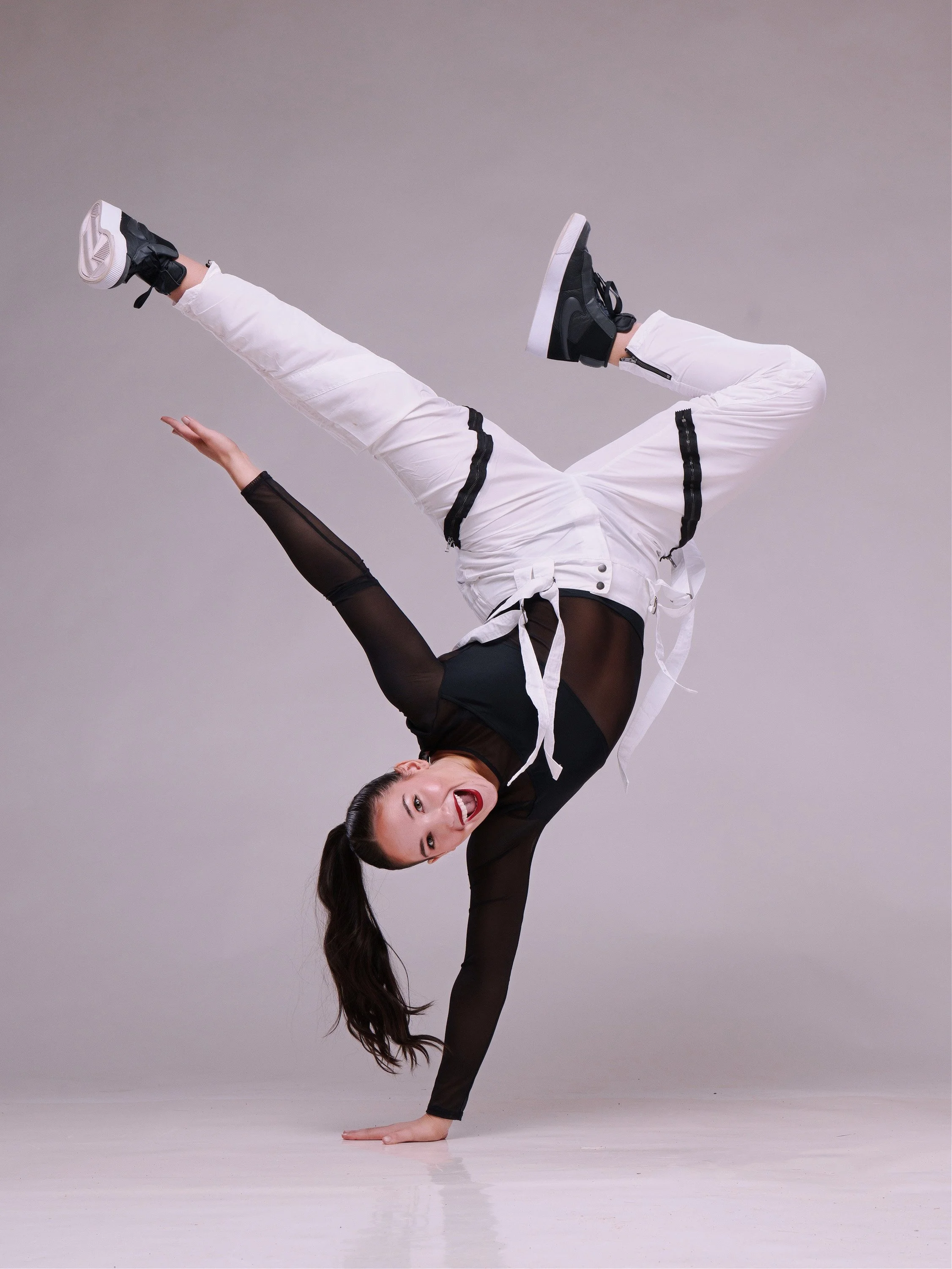 Commercial studio lighting and dramatic media day portraits for dance schools, cheer squads, and gymnastics studios by Justin Grafton Studios