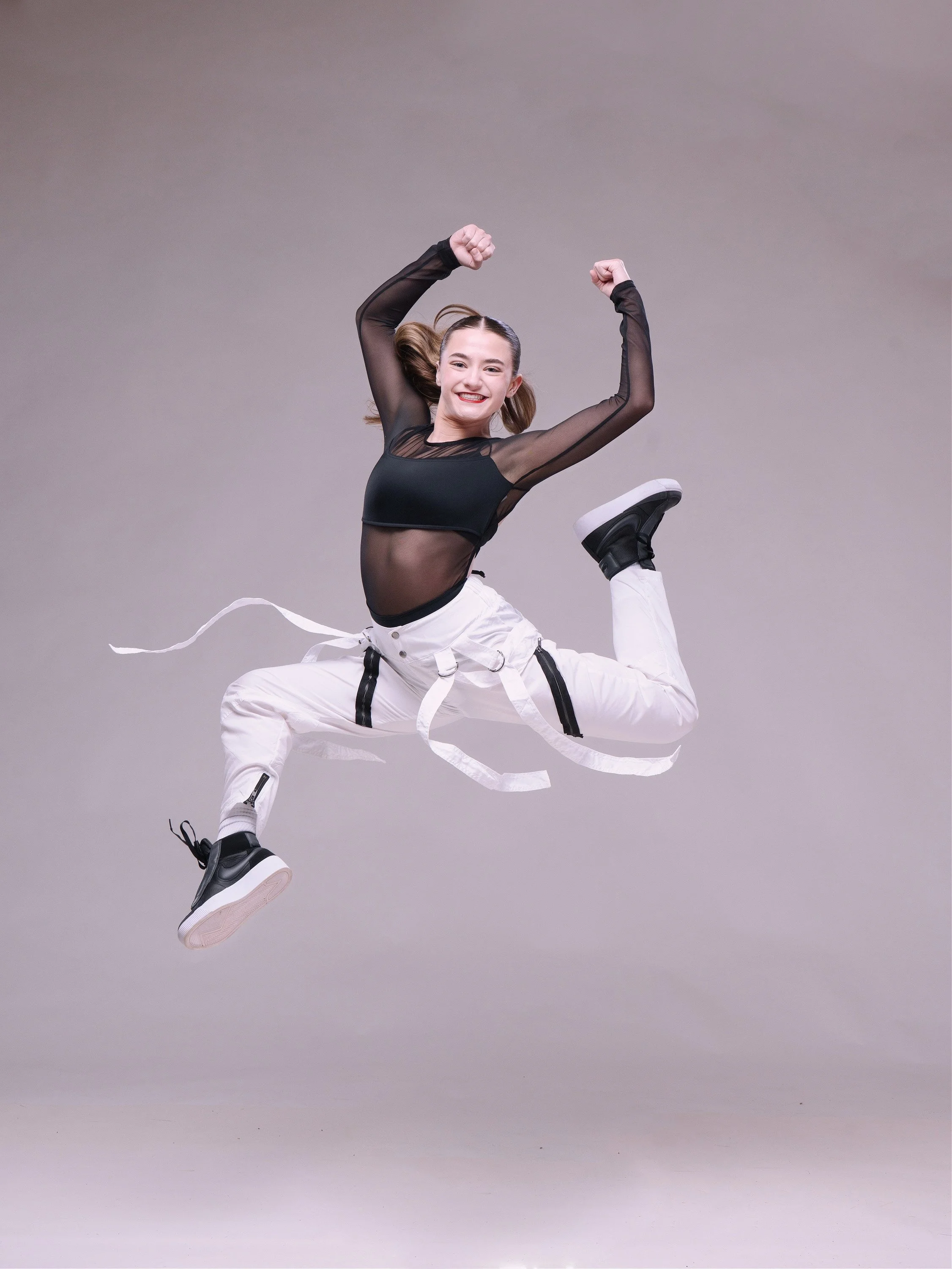 Commercial studio lighting and dramatic media day portraits for dance schools, cheer squads, and gymnastics studios by Justin Grafton Studios