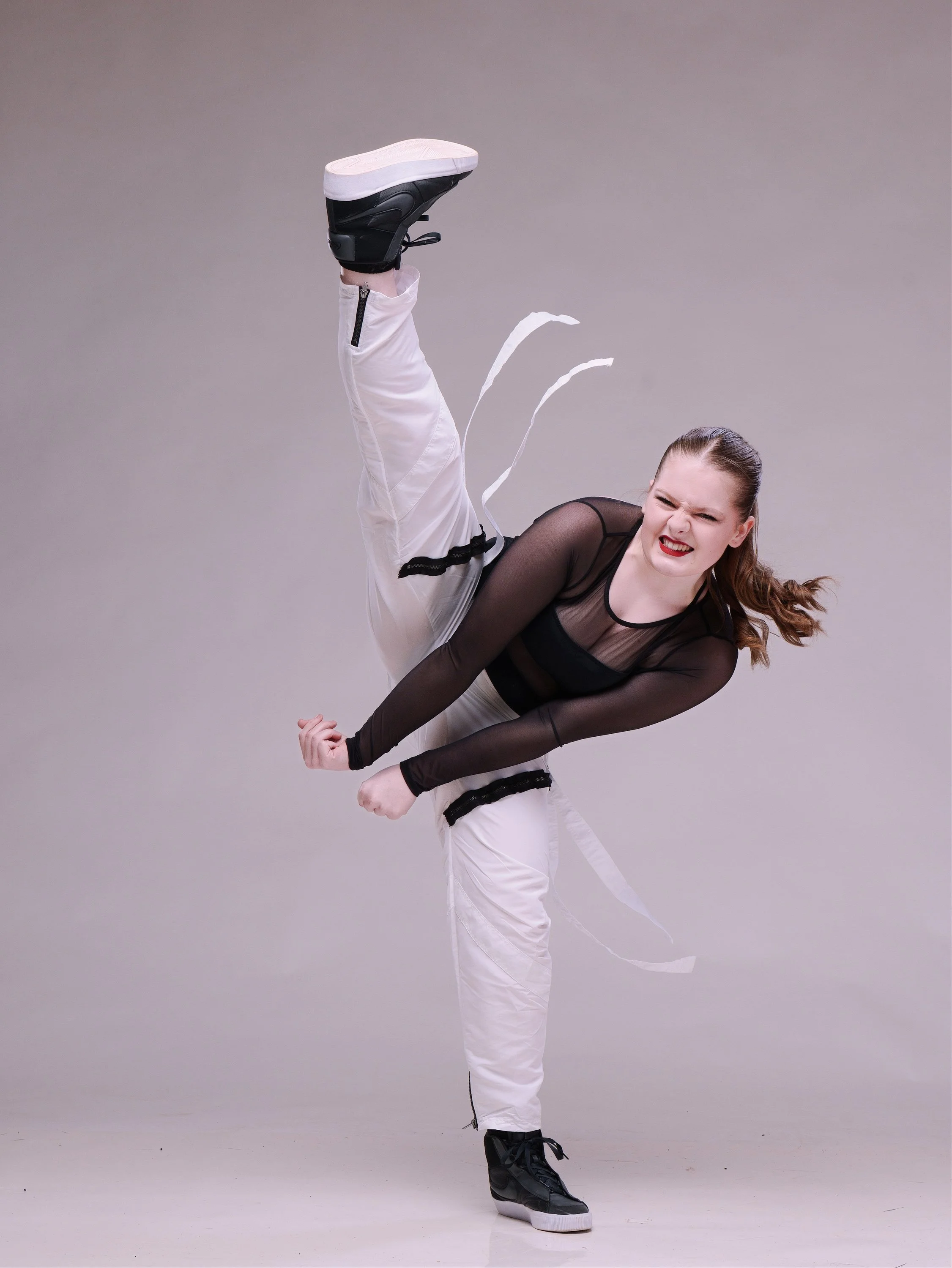 Commercial studio lighting and dramatic media day portraits for dance schools, cheer squads, and gymnastics studios by Justin Grafton Studios