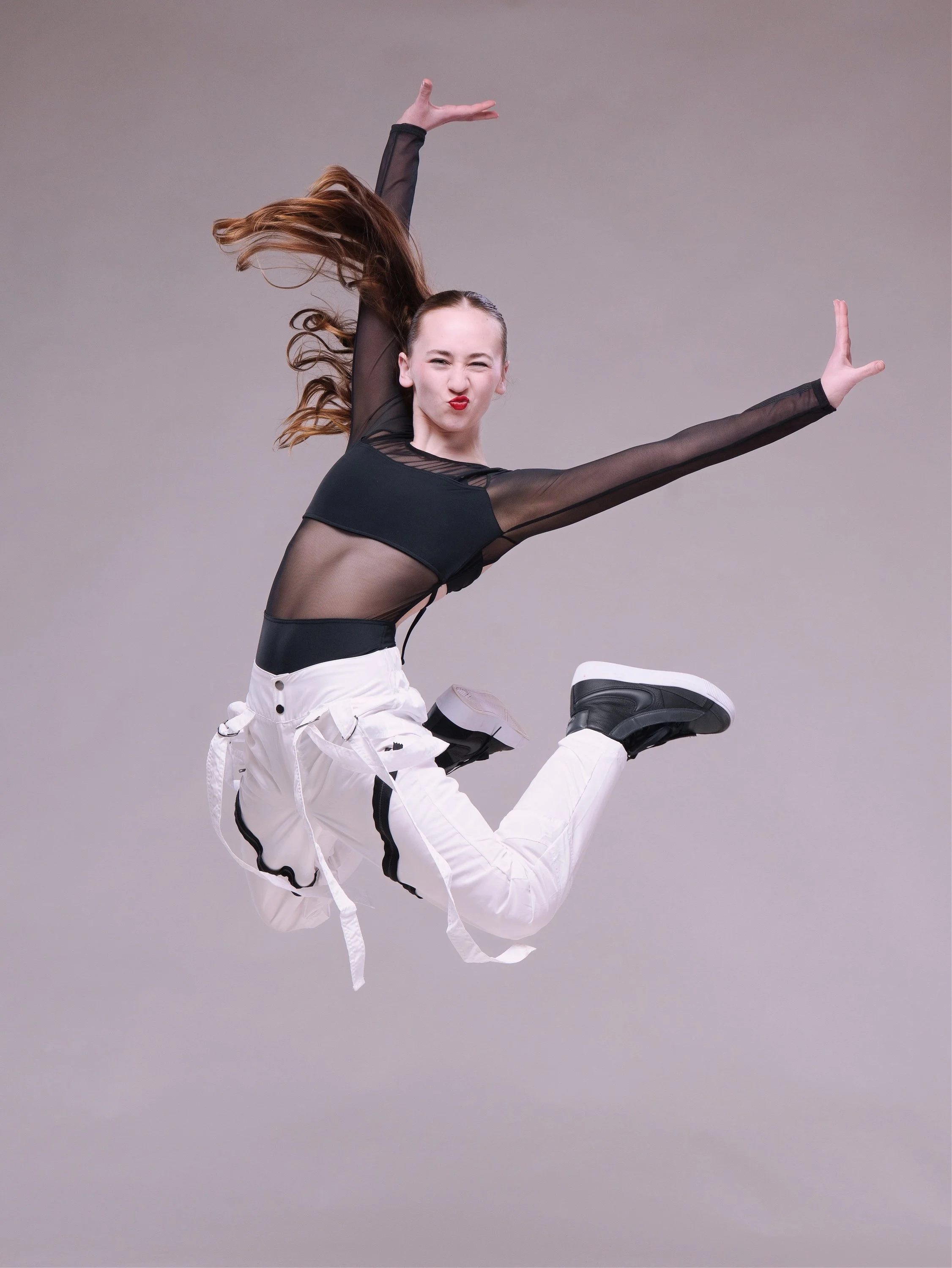 Commercial studio lighting and dramatic media day portraits for dance schools, cheer squads, and gymnastics studios by Justin Grafton Studios