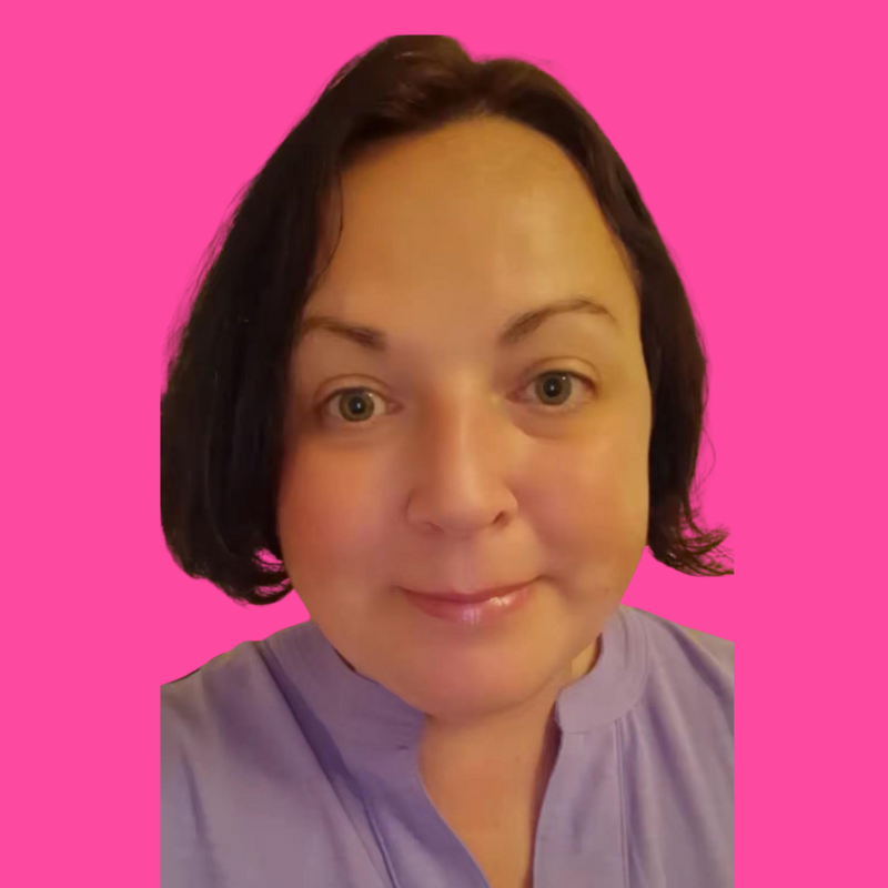 Close-up of a woman with short dark hair and light skin, wearing a light purple shirt, against a pink background.