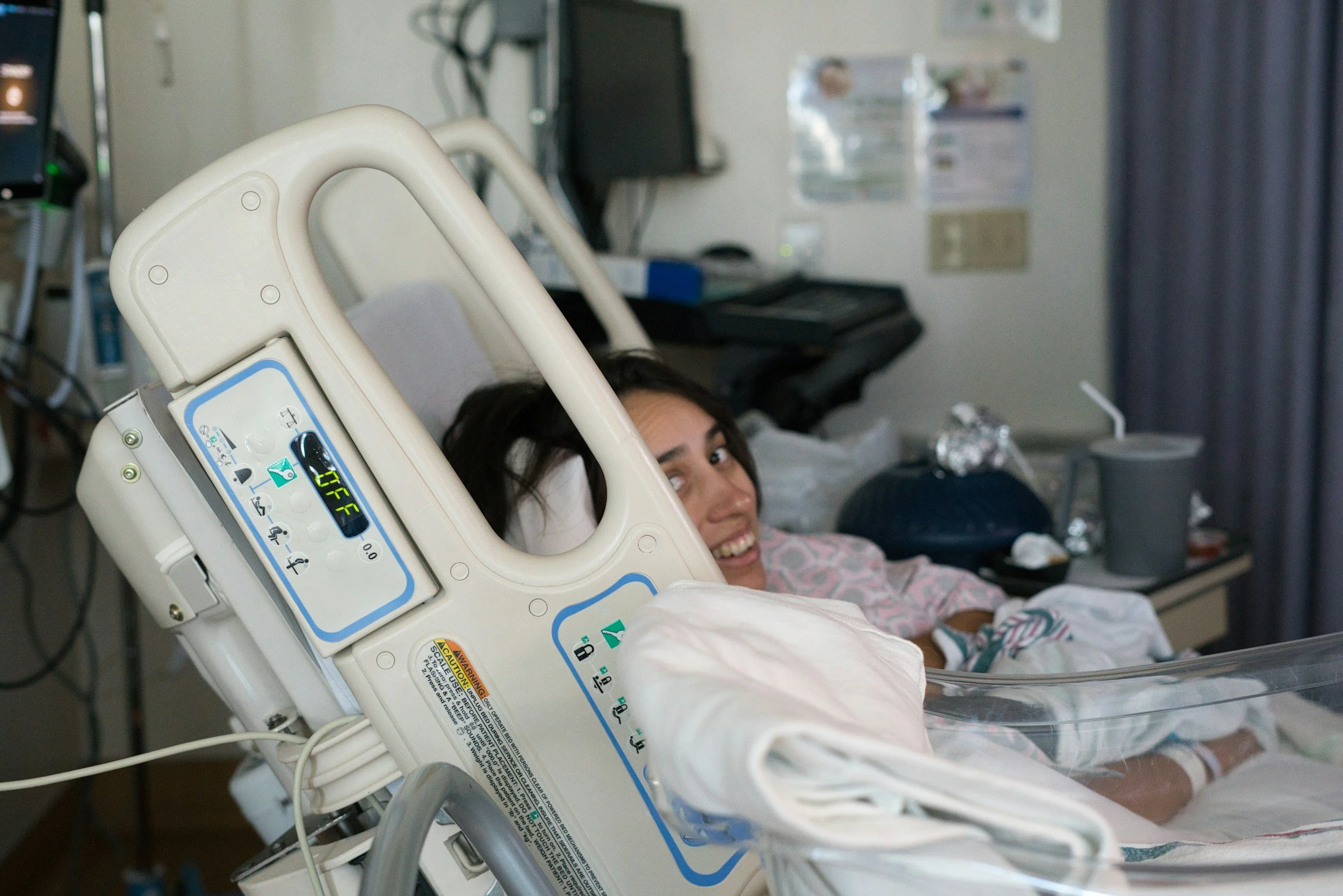 Pregnant woman lying in hospital bed