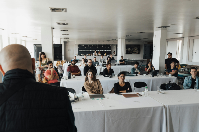 Cross functional workplace team listening and engaging during a group session