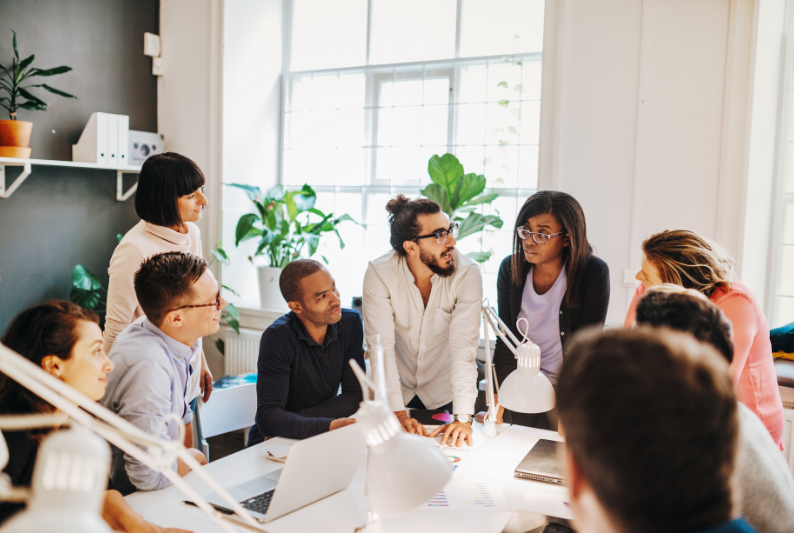 Team discussion reflecting real workplace behaviour rather than training outcomes.