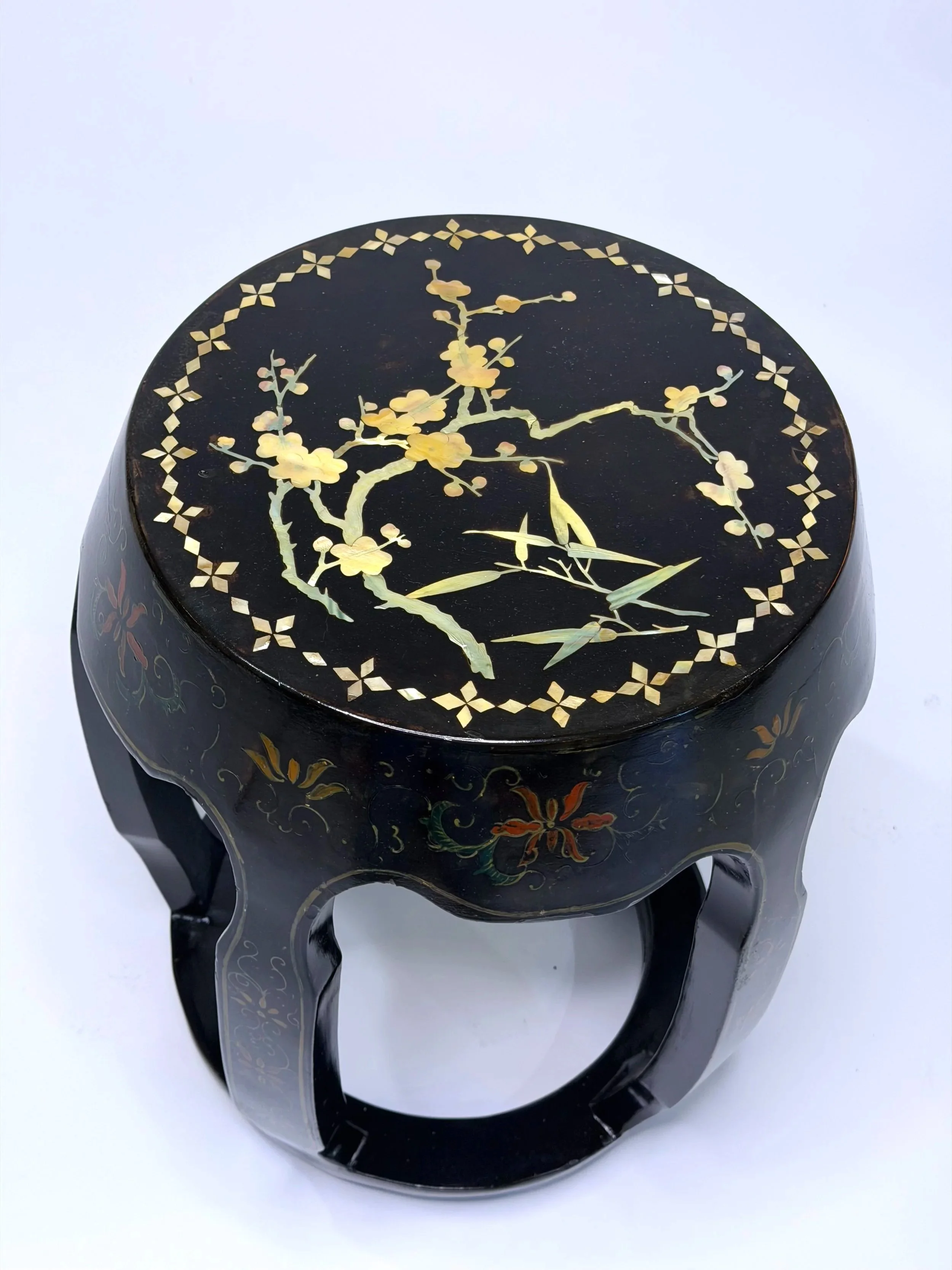 A Vintage Chinese Lacquered open drum stool with mother of pearl shell inlay