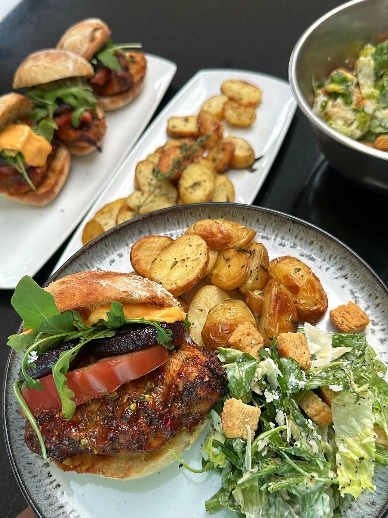 Serving up layers of bold flavour with this sweet chilli chicken burger feast 🔥

Grilled, glazed, and perfectly juicy chicken thighs coated in a homemade sweet chilli sauce, stacked with caramelised red onion rounds, thick-cut beef tomato slices, cr