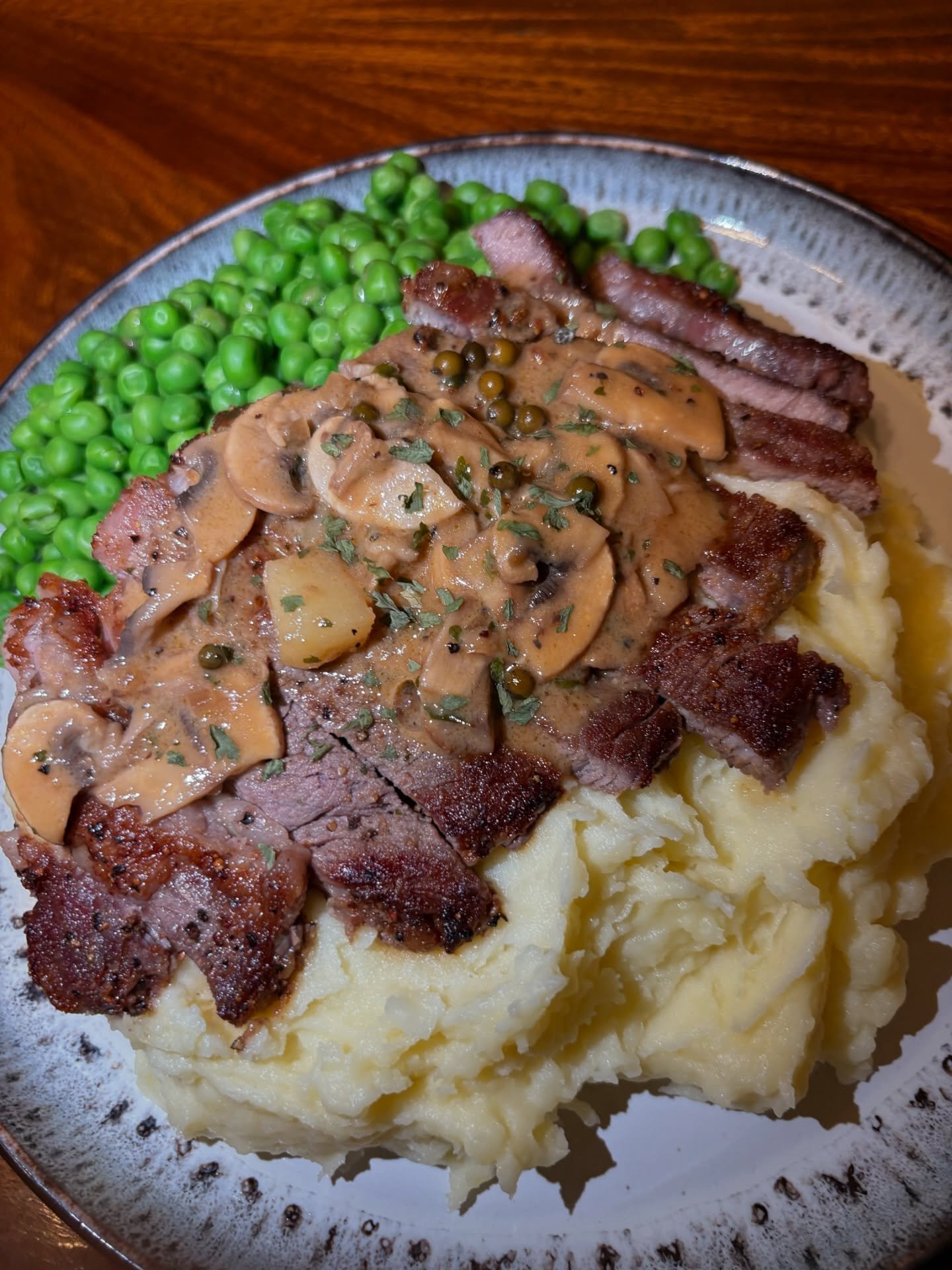 This is what private dining should feel like. Intimate. Sophisticated. Unforgettable. 🌟

Juicy, pan-seared steak served over buttery, creamy mashed potatoes, topped with a rich mushroom and peppercorn sauce paired with tender garden peas for that fi