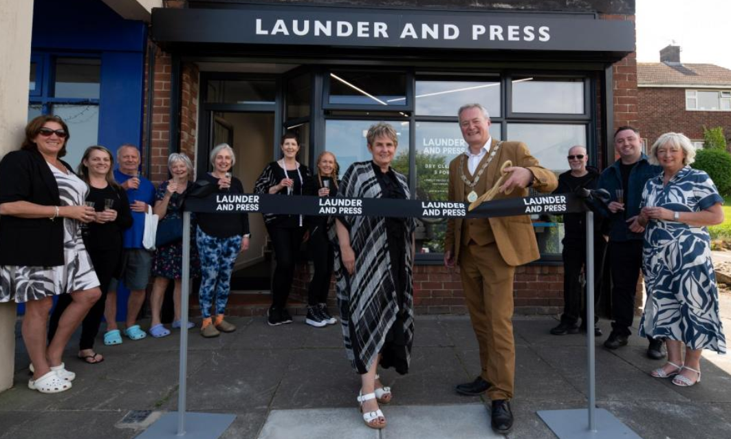 Ribbon-cutting at the opening of the Launder and Press dry cleaners shop in Hexham
