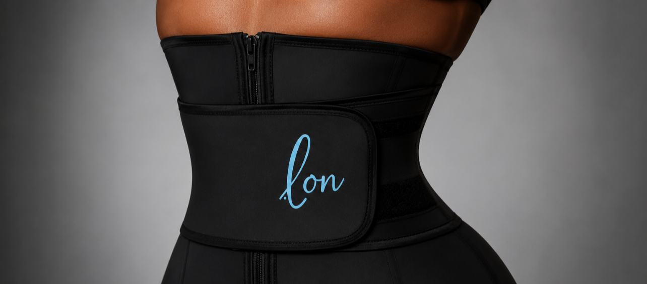 Close-up of a woman wearing a black waist trainer with a pocket that has '.lon' written in blue script.