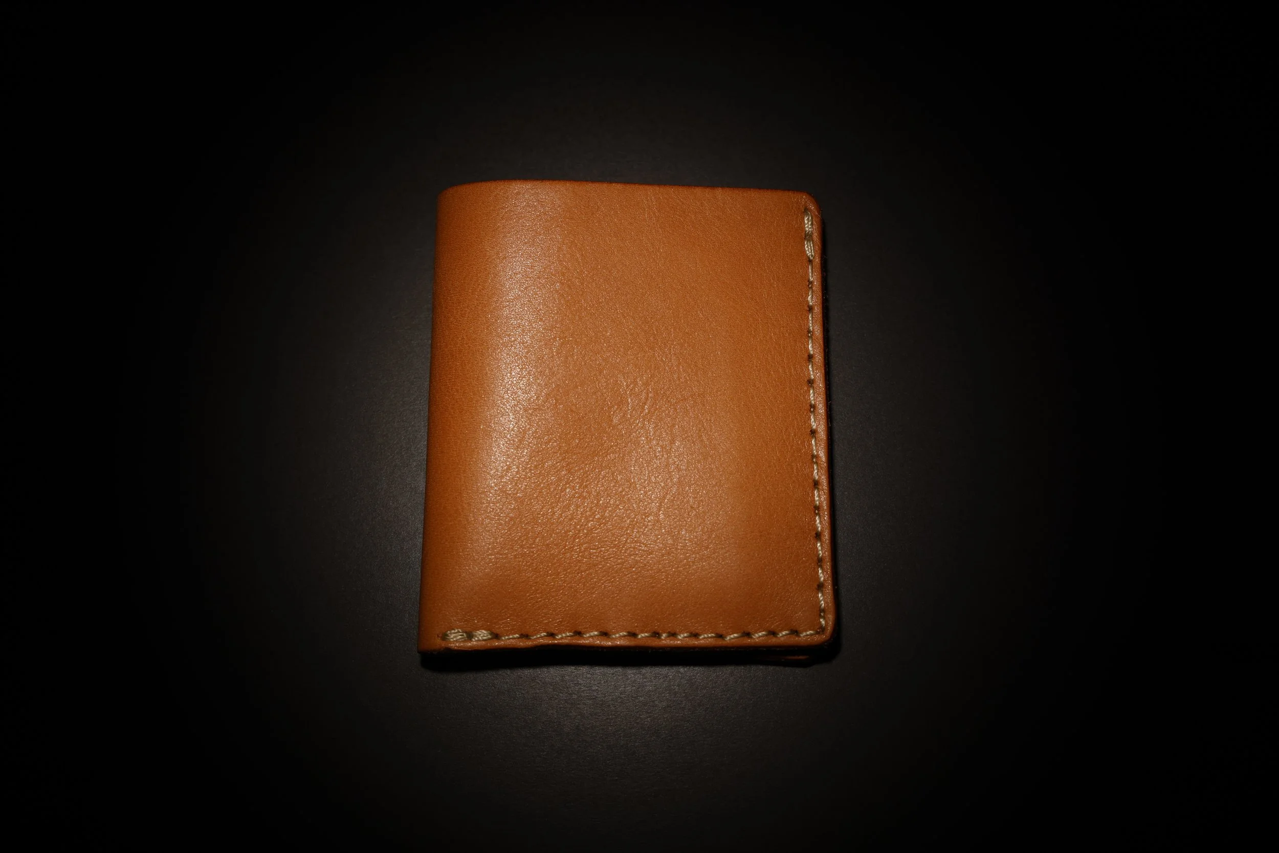 Premium leather wallet commercial product photography for brand visuals.
