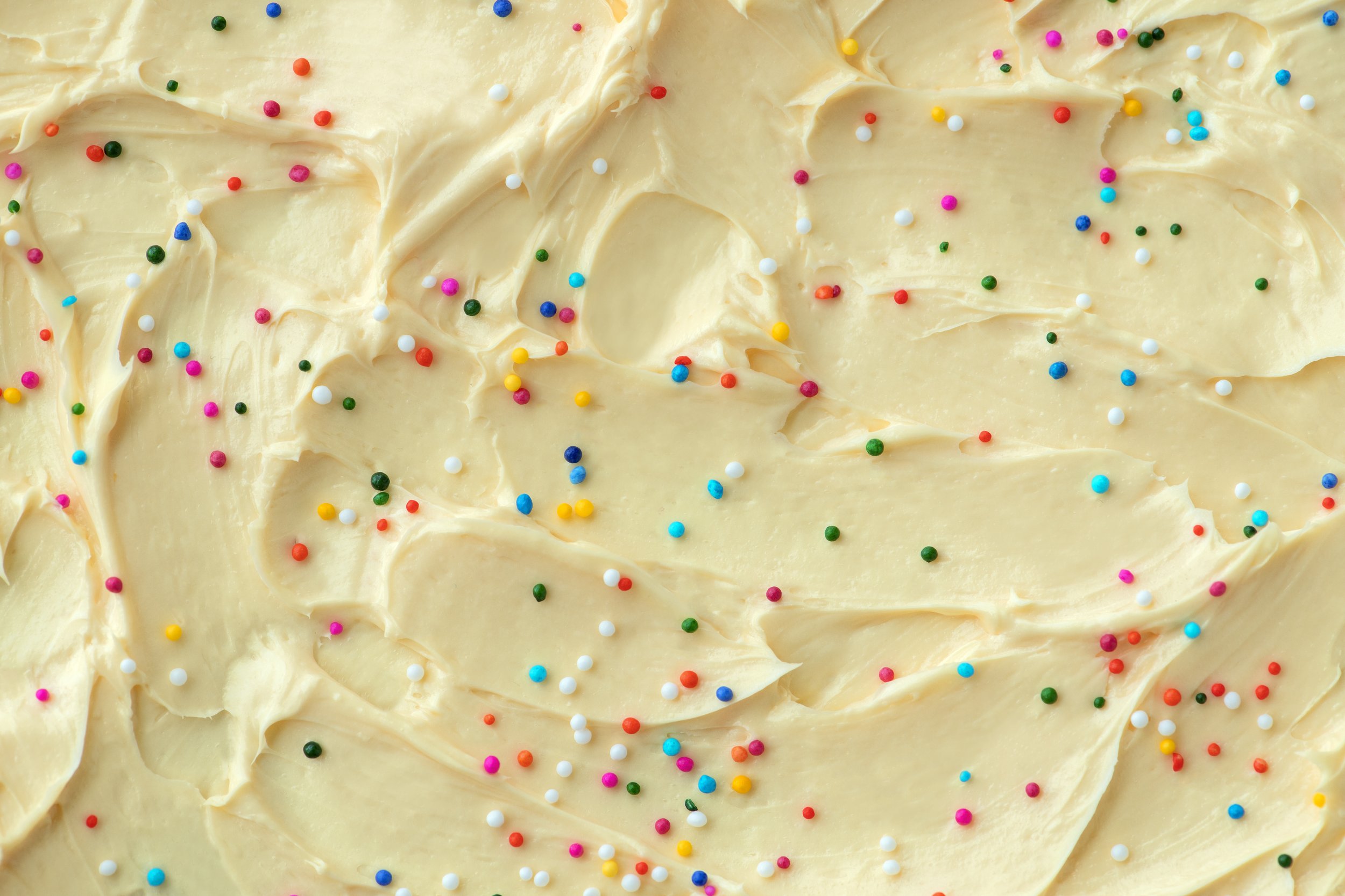 cake-frosting-texture-background-vector-with-sprinkles-top.jpeg