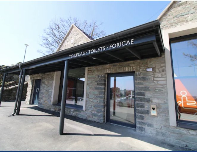 Caer Gybi Roman Fort, Holyhead, with perforated steps and modern design, leading down between stone walls.