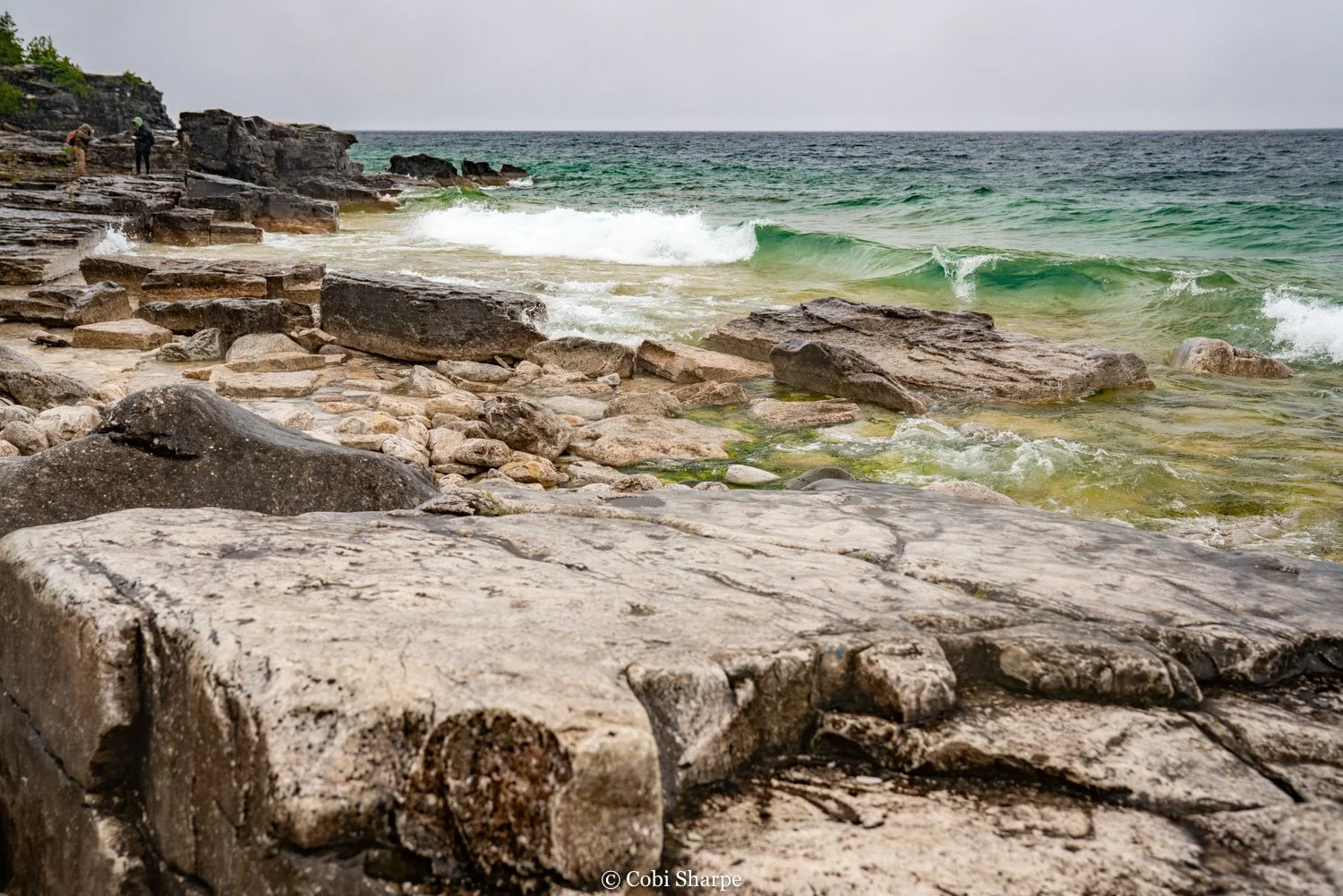 waves crashing on the shoreline landscape of tobermory