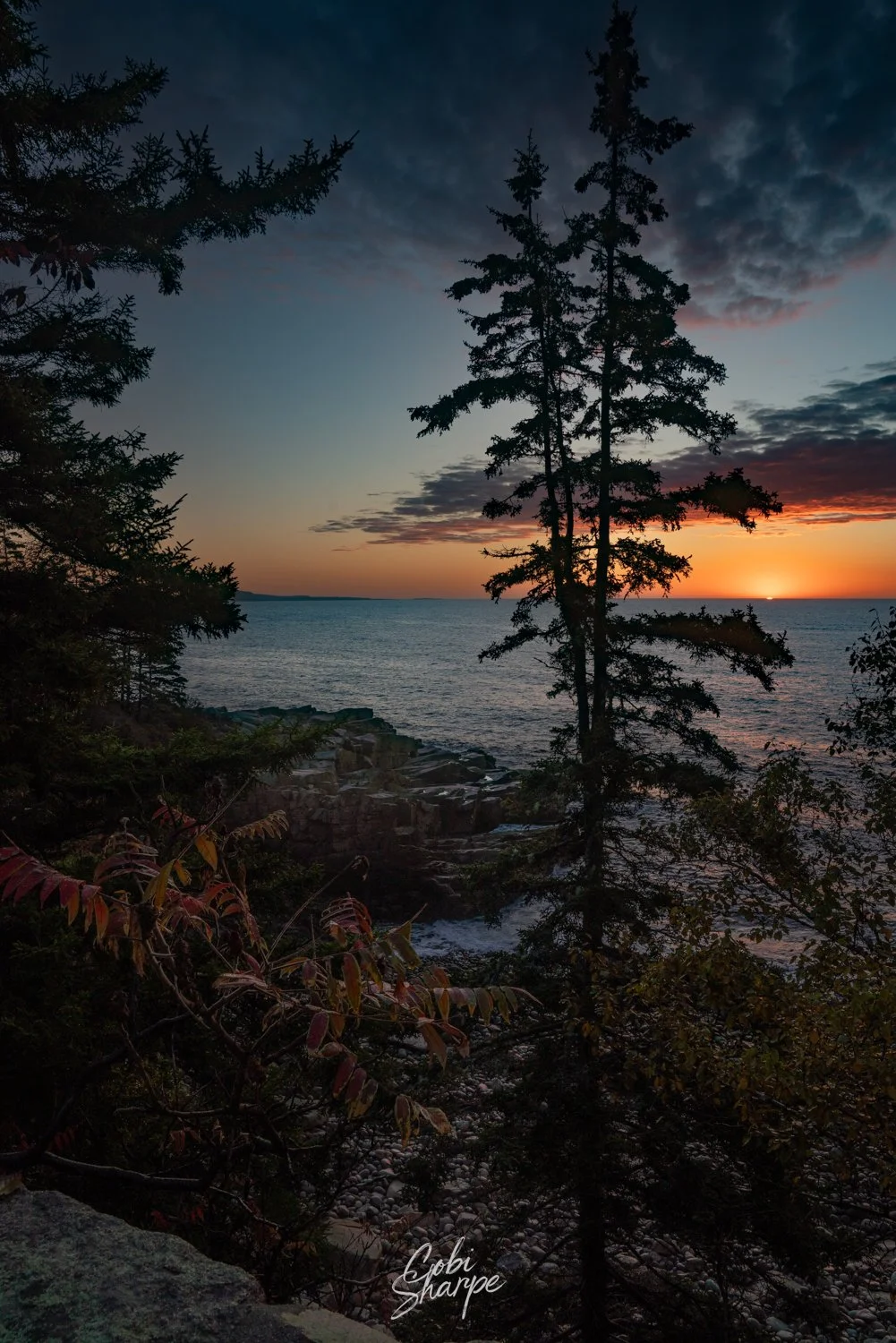 sunrise over the Atlantic ocean, with rugged shoreline