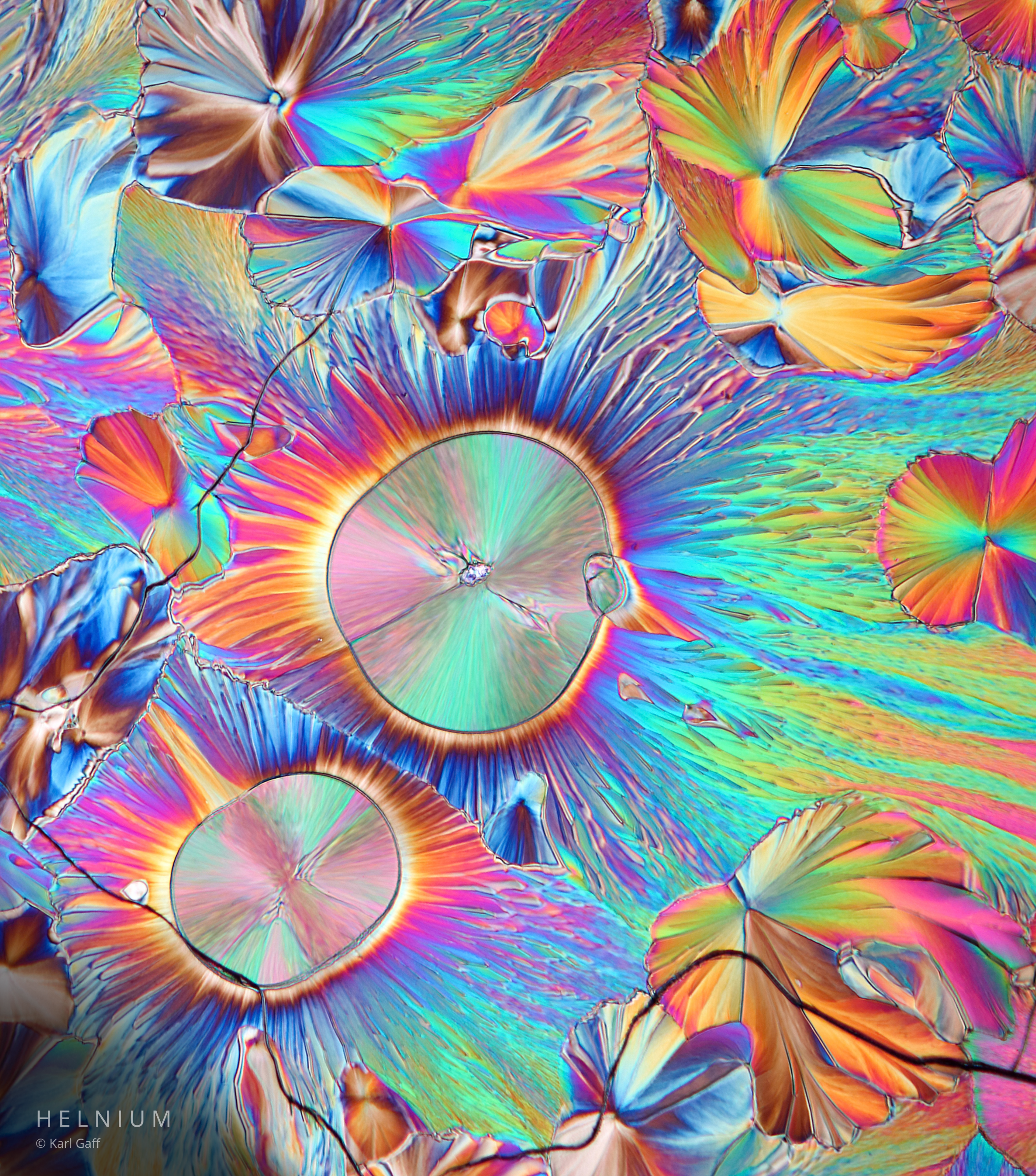 Dopamine crystalline sample photographed through polarized light microscopy. Helnium scientific imagery.