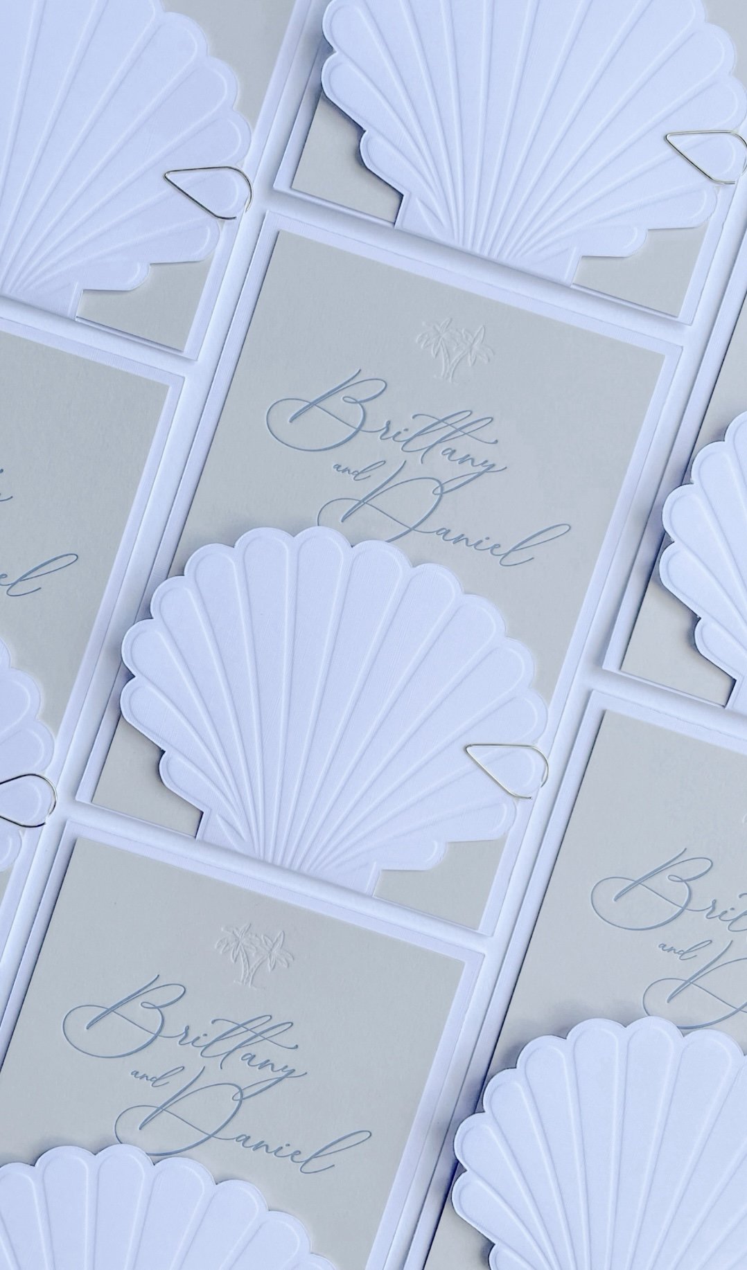 ScallopShellWeddingInvitationSuite_BlueAndCream_Multiple.jpg
