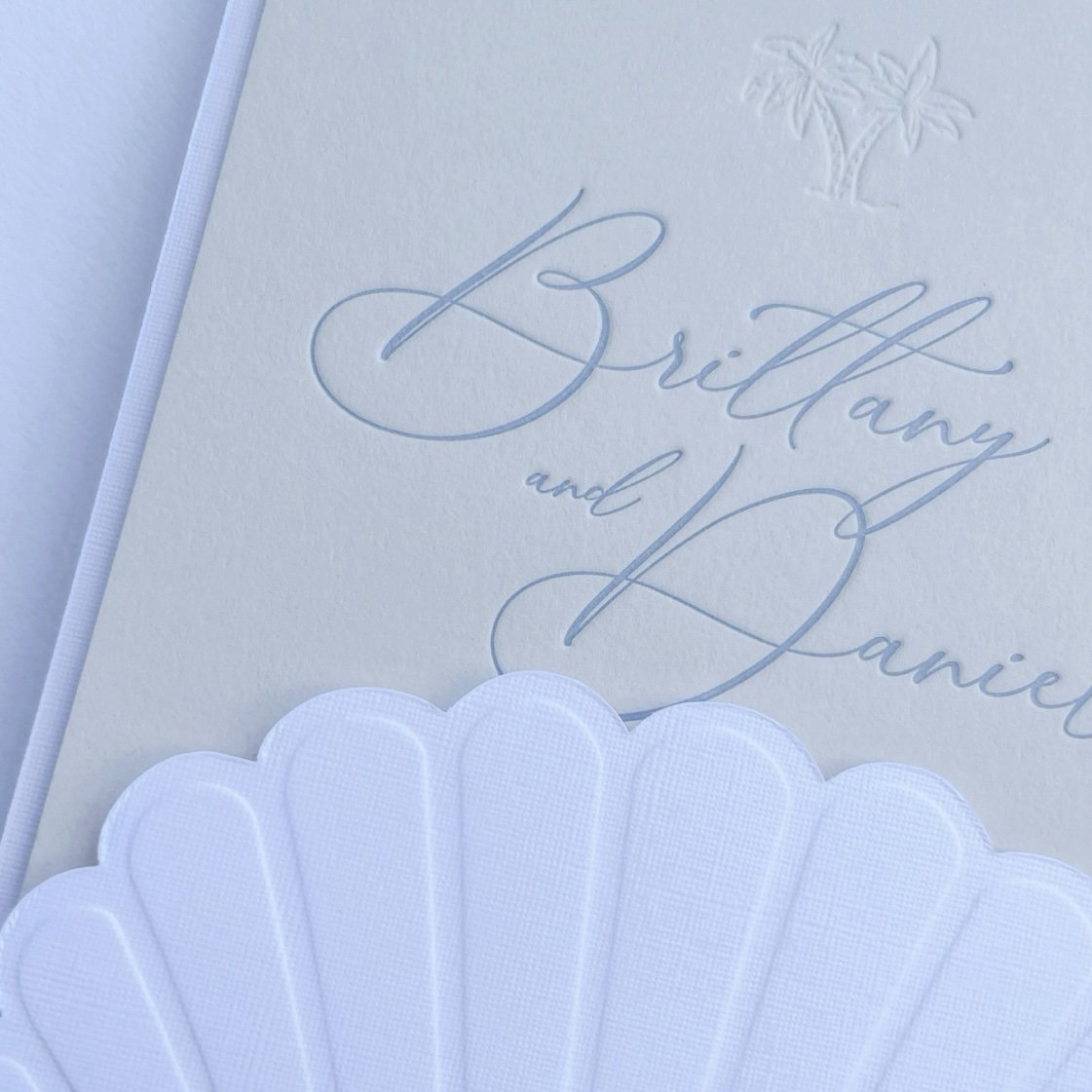 ScallopShellWeddingInvitationSuite_BlueAndCream_CloseUp.jpg